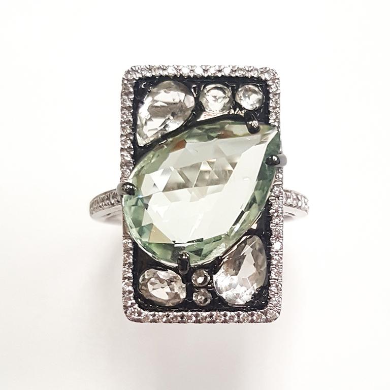 This ladies 14k white gold and green amethyst and round diamond ring has 6.26CT of green amethyst and 0.19CT round diamonds. Comfort fit ring for everyday use.