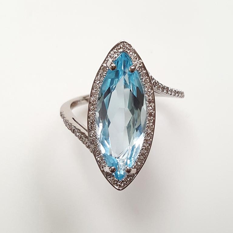 This ladies 14k white gold and marquise blue topaz and round diamonds ring has 4.74CT marquise blue topaz and 0.18CT round diamonds. Comfort fit ring for everyday use.