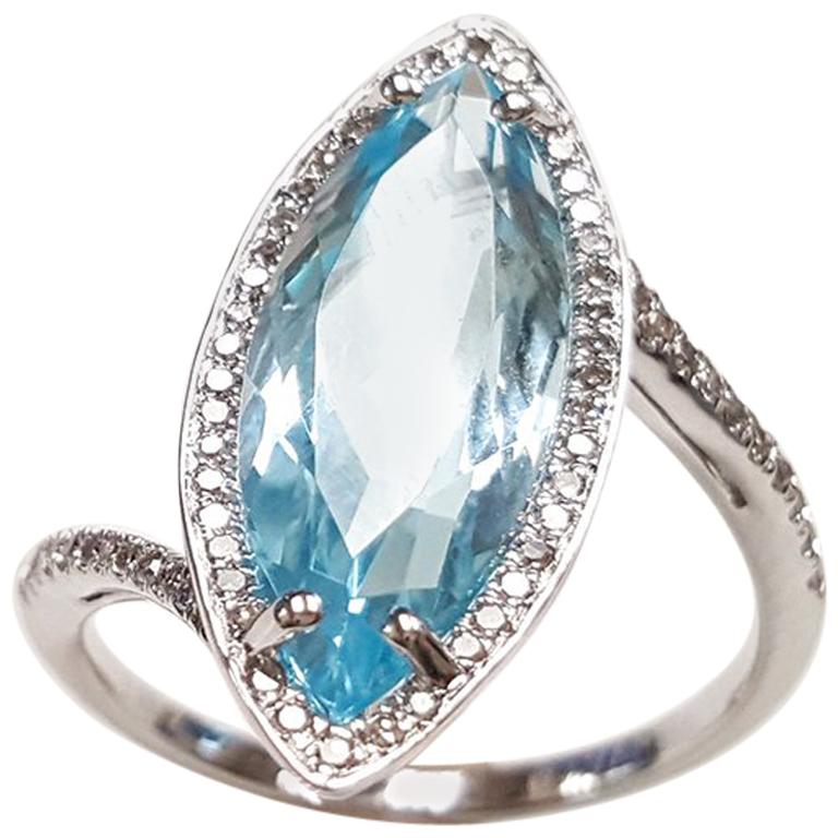 Ladies 14 Karat White Gold Marquise Blue Topaz and Diamond Ring