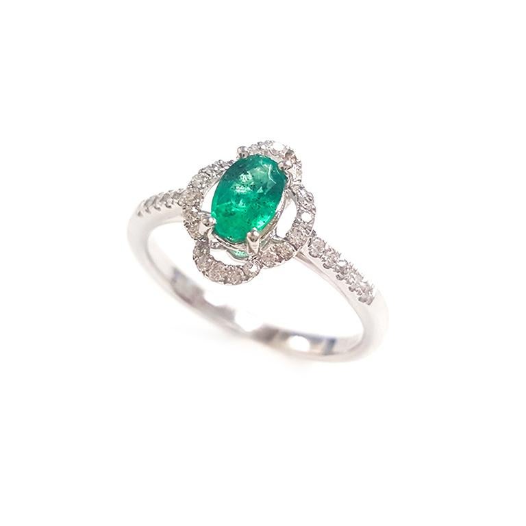 This ladies 14k white gold round emerald and round diamonds ring has 0.35ct oval emerald and 0.21ct round diamonds. 