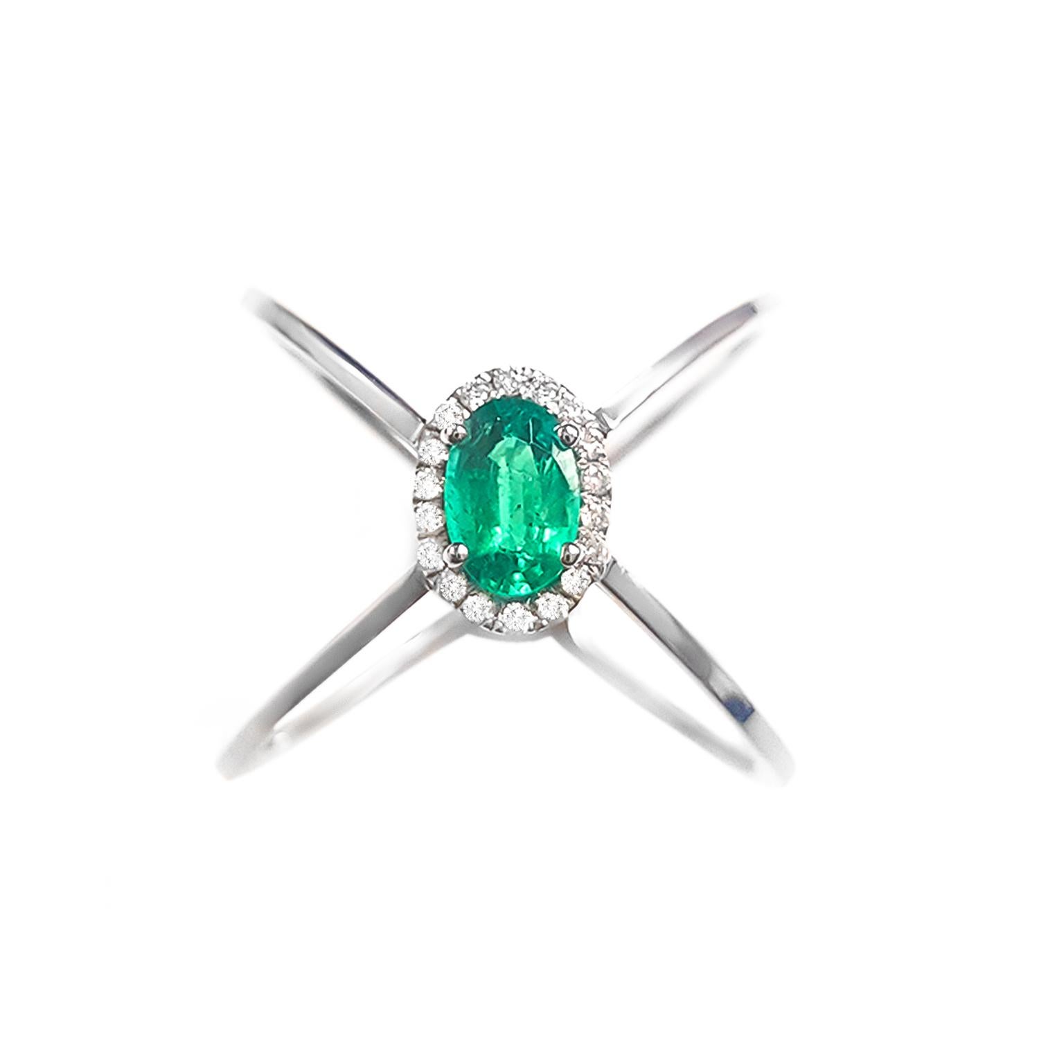 This ladies 14k white gold oval emerald and diamond ring has 0.54ct oval emerald and 0.09ct round diamonds.Fun ring for everyday use. very comfortable. 
