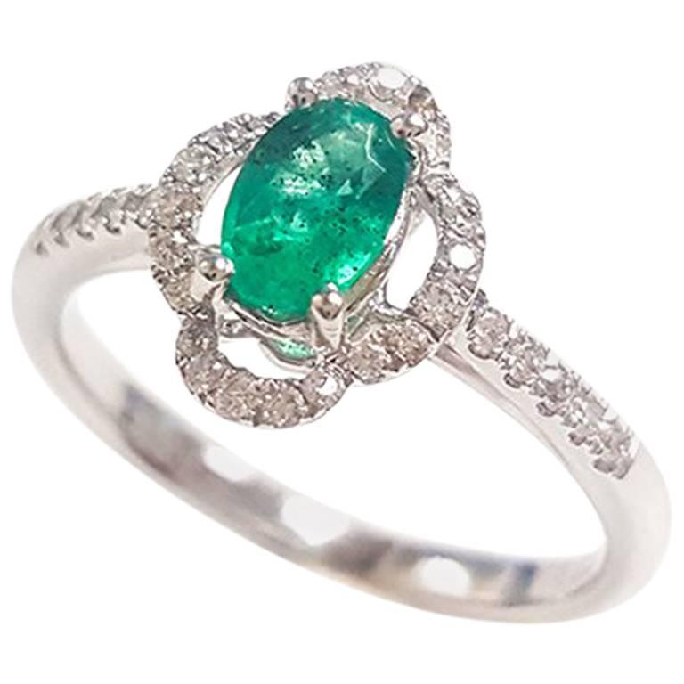 Ladies 14 Karat White Gold Oval Emerald and Round Diamond Ring For Sale