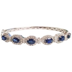 Ladies 14 Karat White Gold Oval Sapphire and Diamonds Bangle