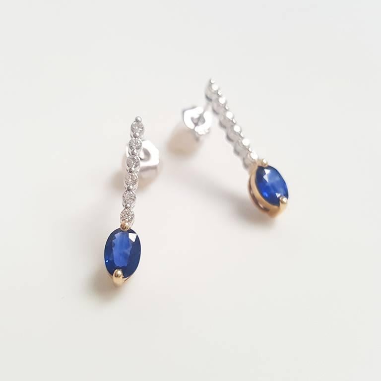 This ladies 14k White gold oval sapphire and round diamond earring has 00.93ct oval sapphire and 0.18ct round diamonds.  