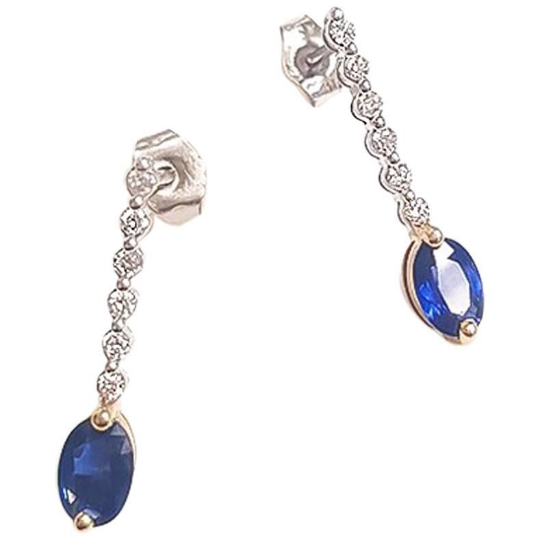 Ladies 14 Karat White Gold Oval Sapphire and Round Diamond Earring For Sale