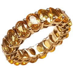 Ladies 14 Karat White Gold Oval Yellow Sapphire Eternity Band