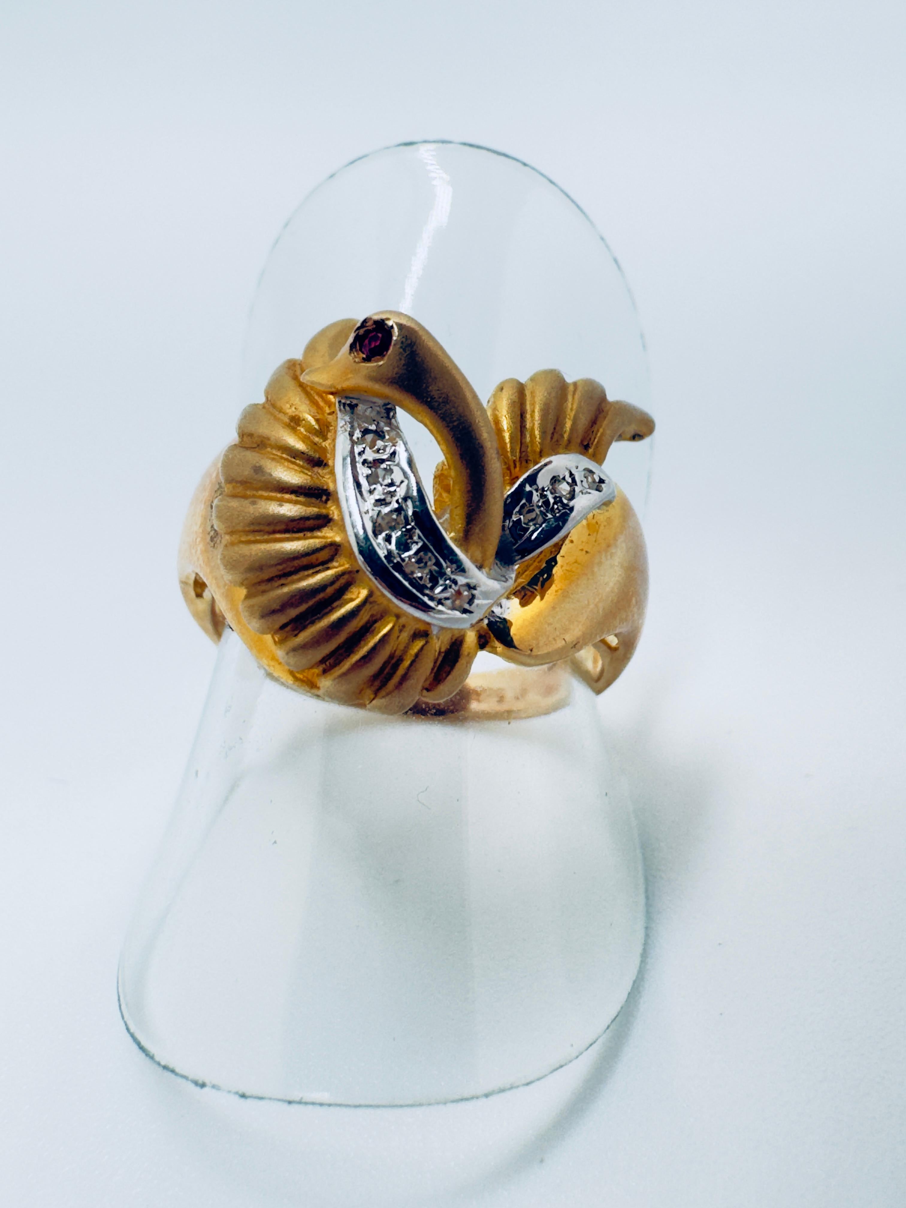 This exquisite ladies’ ring is crafted in 14 karat yellow gold and features a graceful swan with elegantly open wings, symbolizing beauty, freedom, and sophistication. The swan’s body is adorned with seven round brilliant-cut diamonds, pavé set to