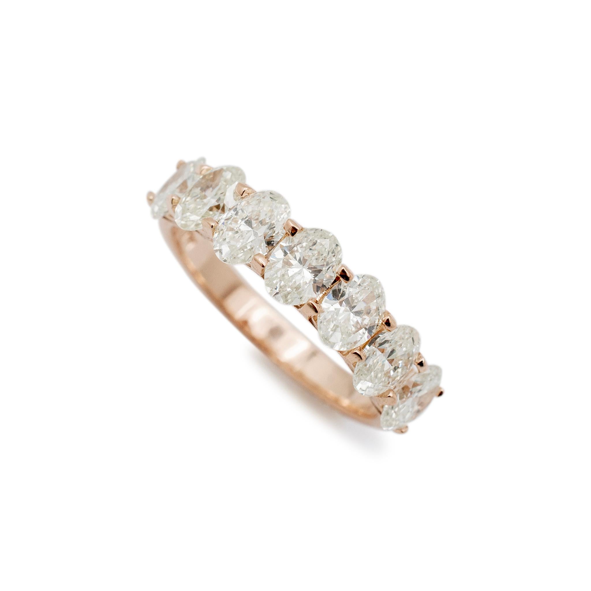 Gender: Ladies

Metal Type: 14K Rose Gold

Size: 7

Shank Maximum Width: 2.70 mm

Weight: 3.20 Grams

Ladies 14K rose gold seven-across diamond semi-eternity band with a half-round shank. The metal was tested and determined to be 14K rose gold.