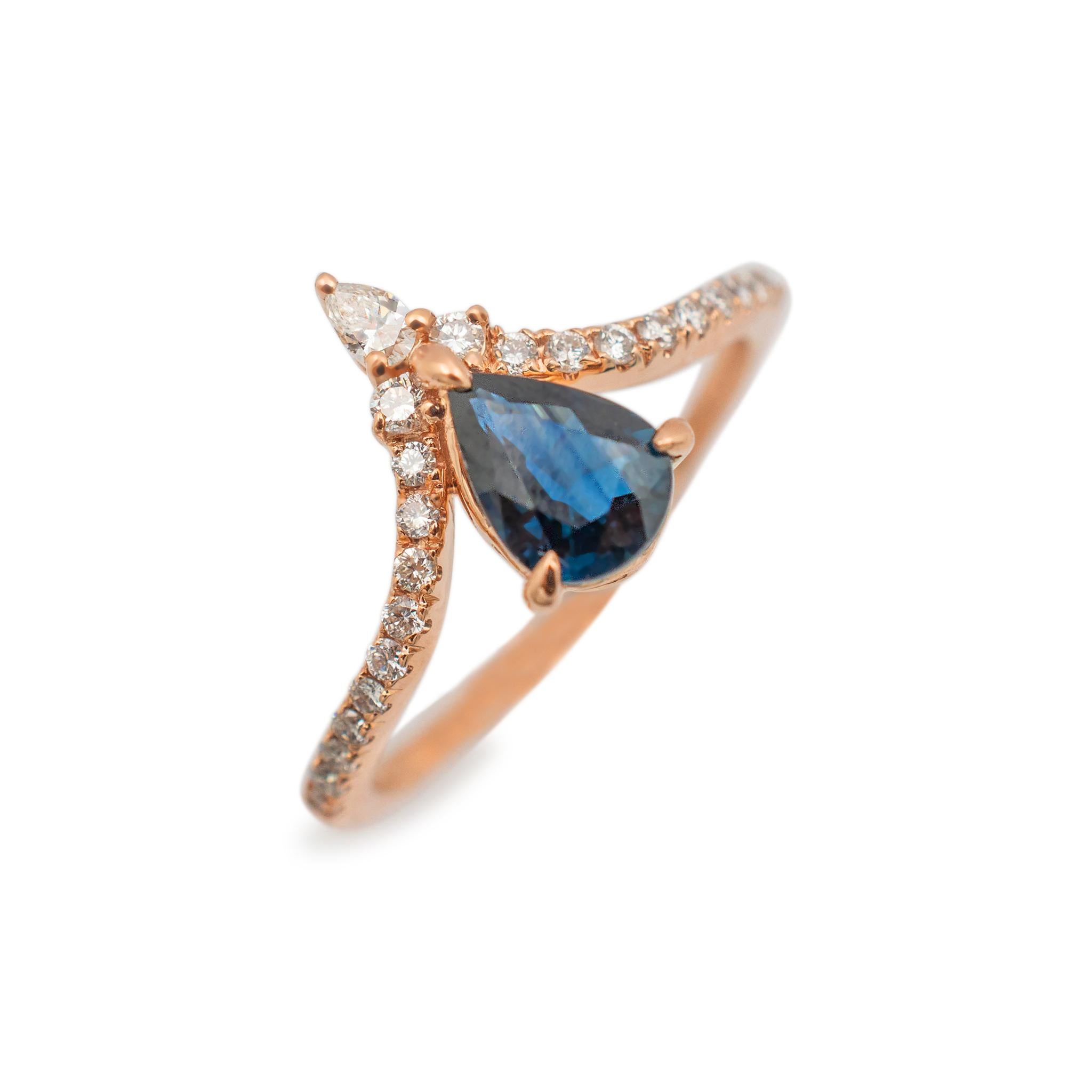 Gender: Ladies

Metal Type: 14K Rose Gold

Size: 6.75

Shank Width: 1.45mm

Head measurements: 11.95mm in length by 6.65mm in width

Weight: 2.40 grams

Lady's custom made polished 14K rose gold, diamond and sapphire cocktail ring with a half round