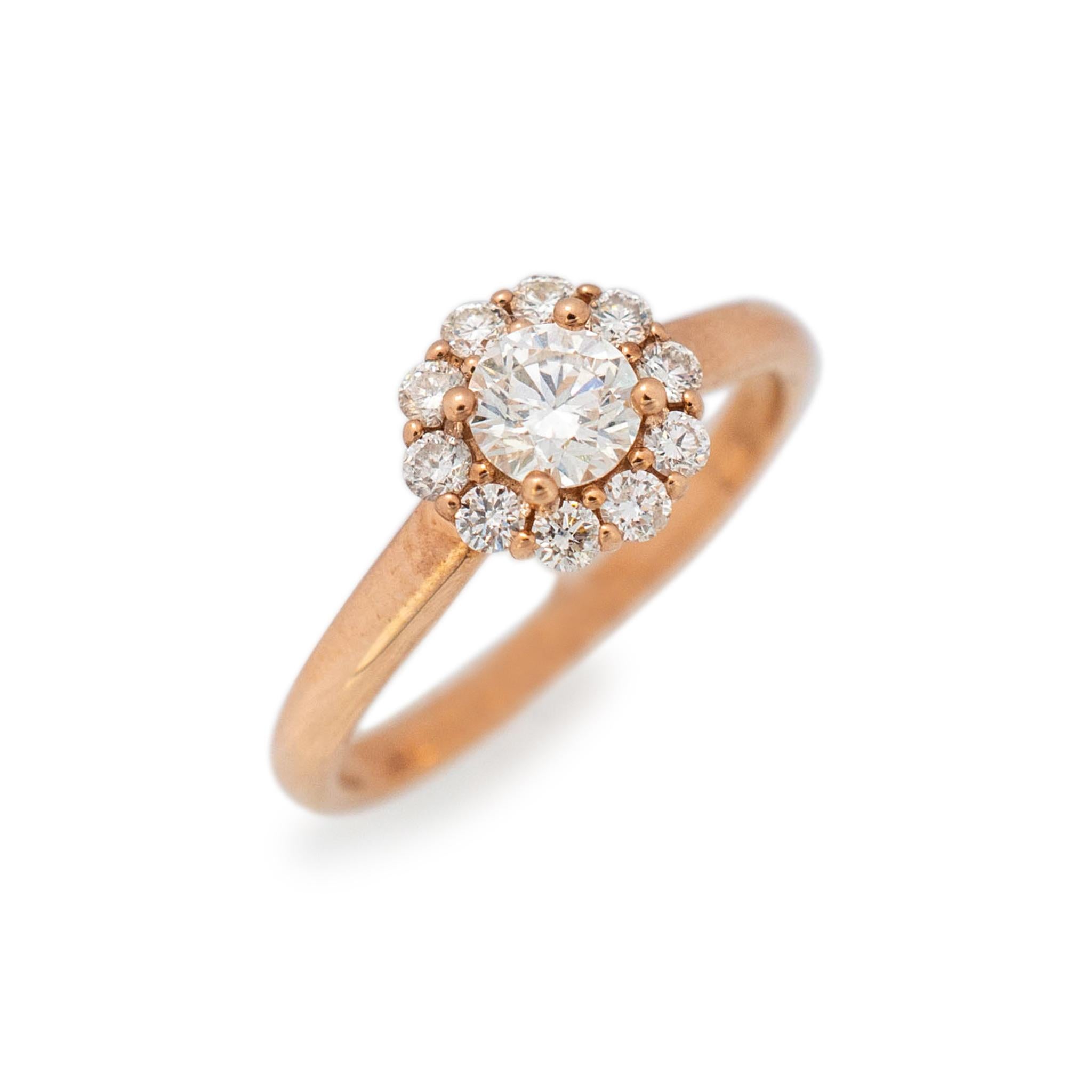 Gender: Ladies

Material: 14K Rose Gold

Size: 6

Shank Width: 2.30mm

Weight: 2.60grams

Ladies 14K rose gold, diamond halo engagement ring with a half round shank. Engraved with 