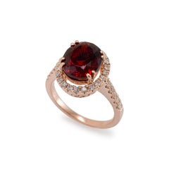 Ladies 14K Rose Gold Garnet Halo Diamond Cocktail Ring