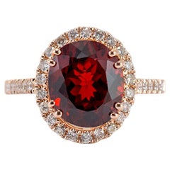 Ladies 14K Rose Gold Garnet Halo Diamond Cocktail Ring