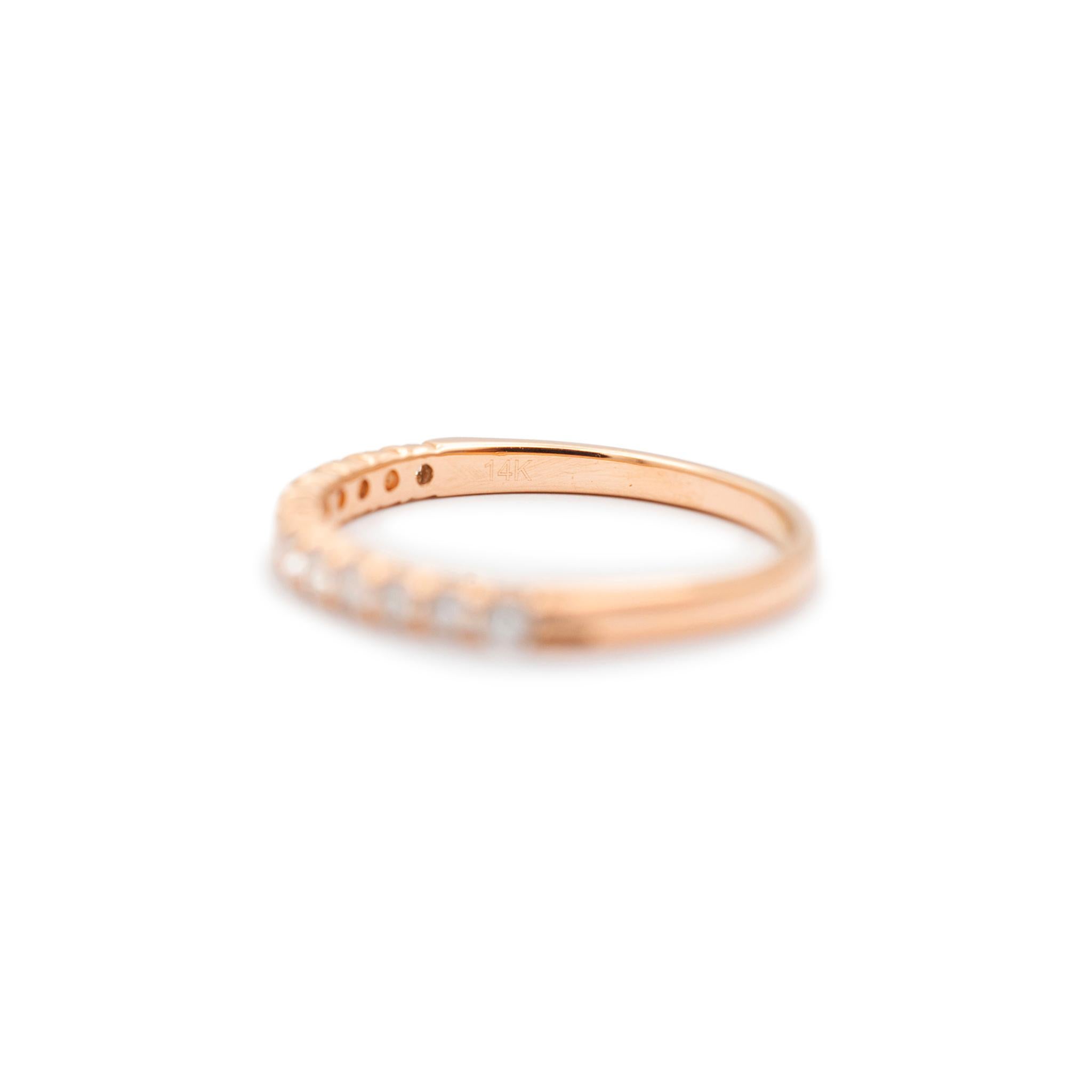 Gender: Ladies
Metal Type: 14K Rose Gold
Size: 5
Width: 2.05 mm
Weight: 1.42 grams
One lady's 14K rose gold, diamond eternity band with a half-round shank. Stamped 