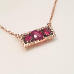 Ladies 14 Karat Rose Gold Rubies and Diamond Pendant
