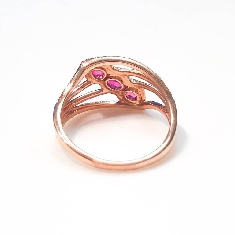 Pear Cut Ladies 14 Karat Rose Gold Rubies and Diamonds Ring For Sale