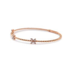 Bracelet jonc souple pour femmes en or rose 14 carats avec trois papillons et diamants