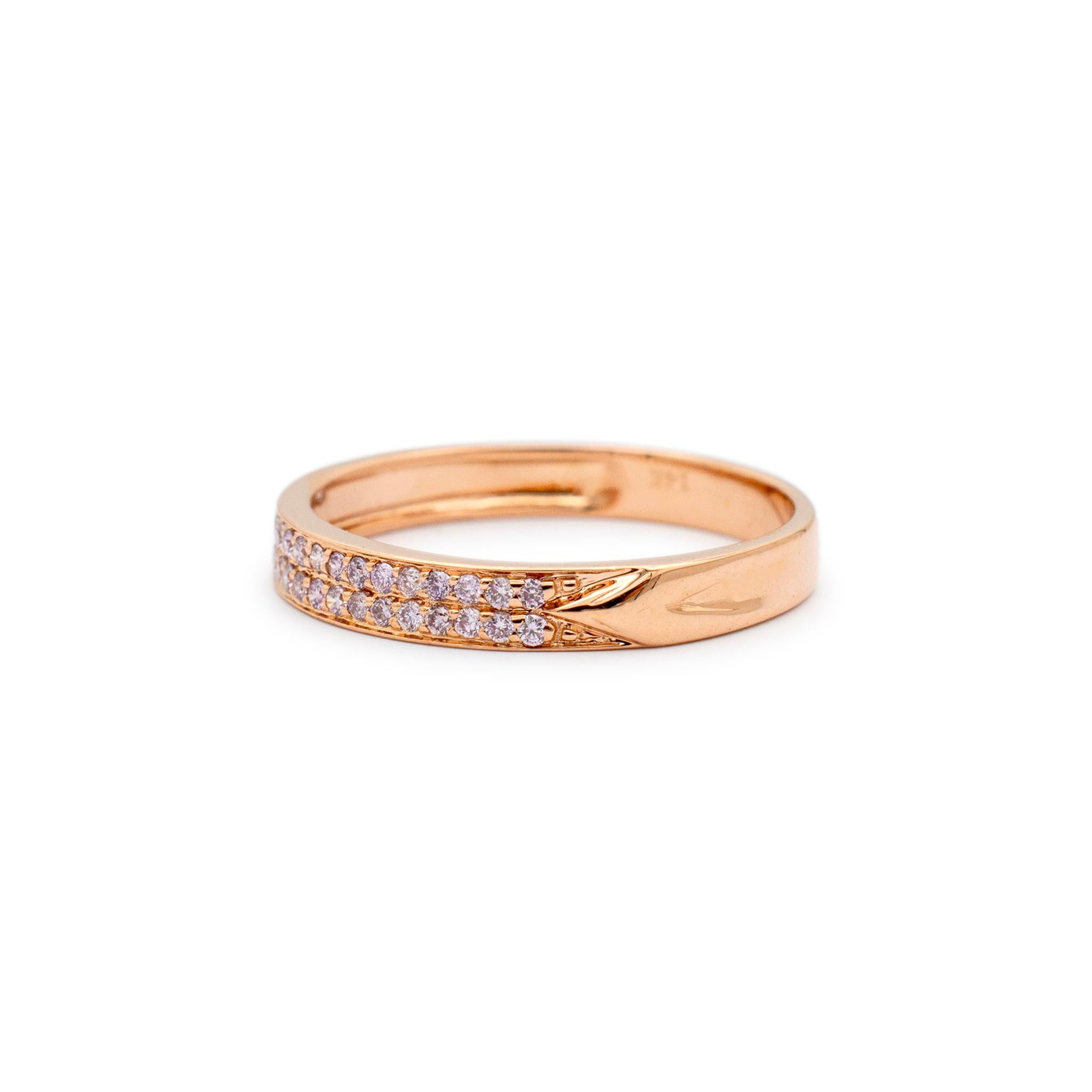 Gender: Ladies

Metal Type: 14K Rose Gold

Size: 7

Width: 3.05 mm

Weight: 1.88 grams

One ladies 14K rose gold two-row diamond wedding band with a half-round shank. The metal was tested and determined to be 14K rose gold. Engraved with 