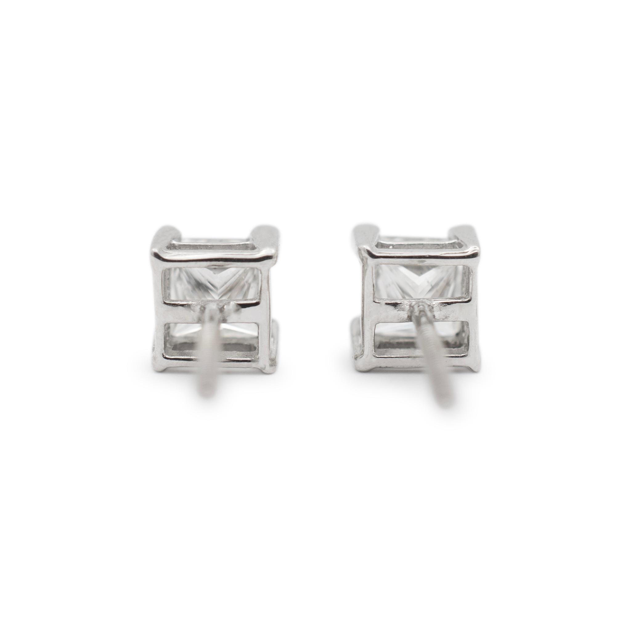 Gender: Ladies

Metal Type: 14K White Gold

Length: 0.50 Inches

Width: 5.50 mm

Weight: 1.56 grams

Ladies 14K white gold diamond stud earrings with screw backs. The metal was tested and determined to be 14K white gold. Engraved with
