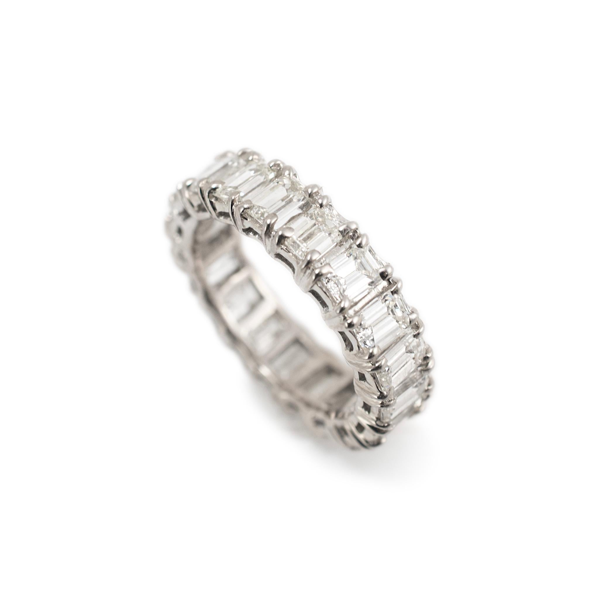 Gender: Ladies

Metal Type: 14K White Gold

Ring Size: 5.25 

Width: 4.90 mm

Weight: 4.74 grams

Ladies rhodium-plated 14K white gold diamond eternity band with a soft-square shank. 

Pre-owned In excellent condition. Might show minor signs of
