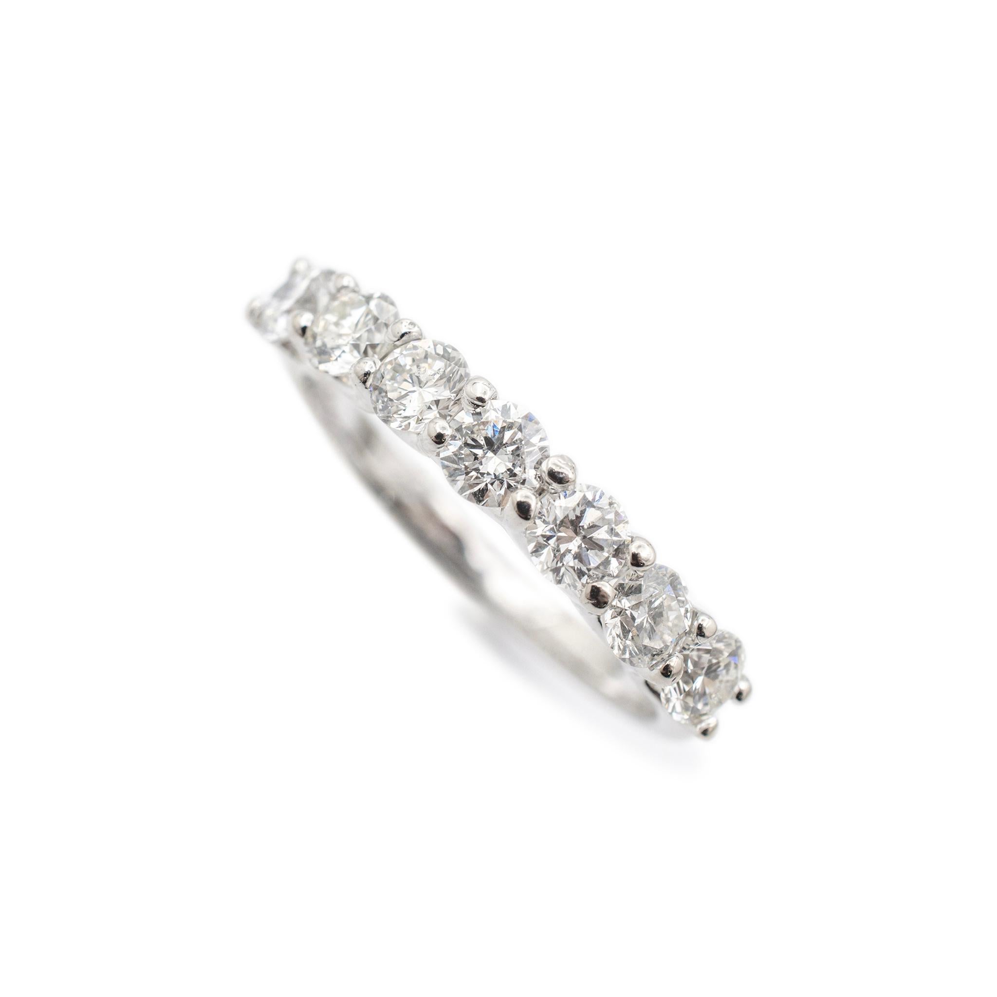 Gender: Ladies

Metal Type: 14K White Gold

Size: 7

Shank Maximum Width: 2.10 mm

Weight: 2.70 Grams

Ladies 14K white gold seven-across diamond wedding band with a half-round shank. The metal was tested and determined to be 14K white gold.