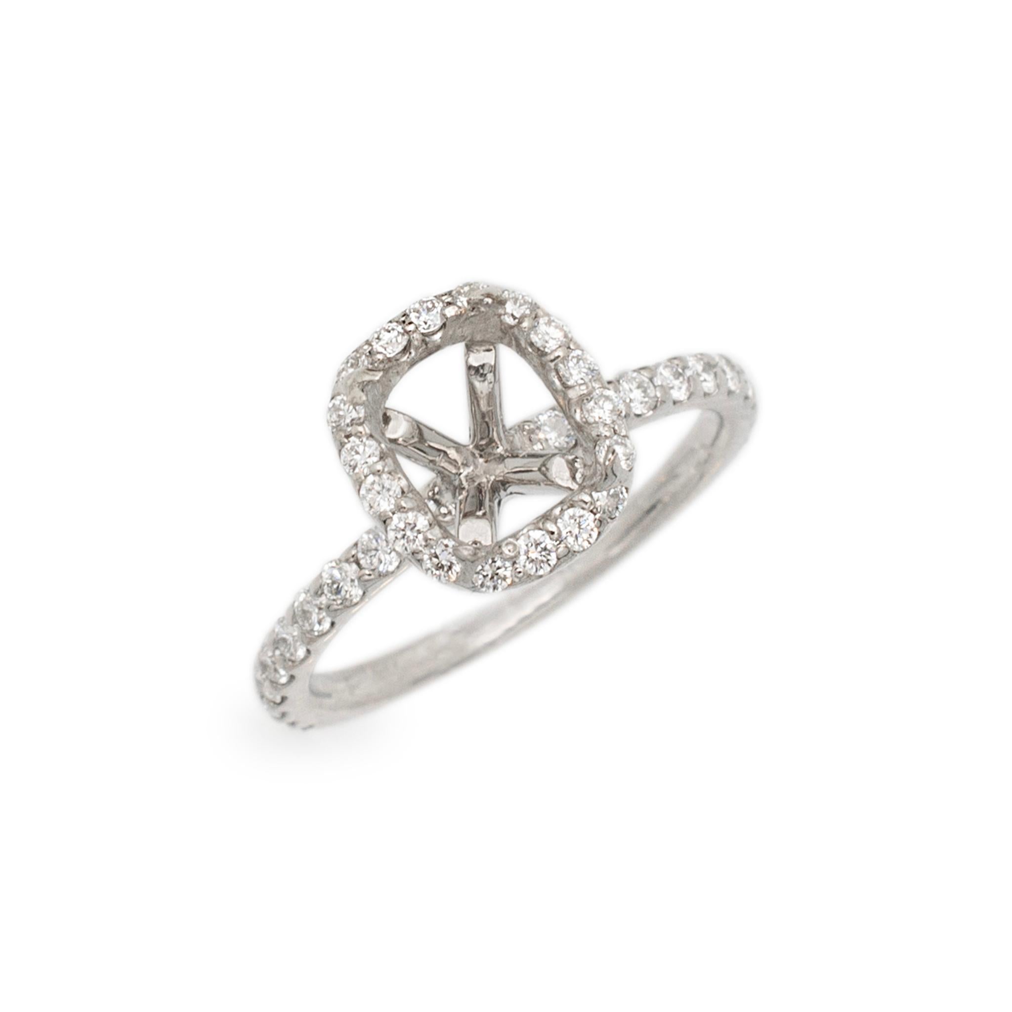 Gender: Ladies

Metal Type: 14K White Gold

Size: 5

Weight: 2.34 grams

Ladies 14K white gold diamond halo accented engagement semi-mount ring with a half round shank. The ring is a size 5. The ring weighs a total of 2.34 grams. Engraved with