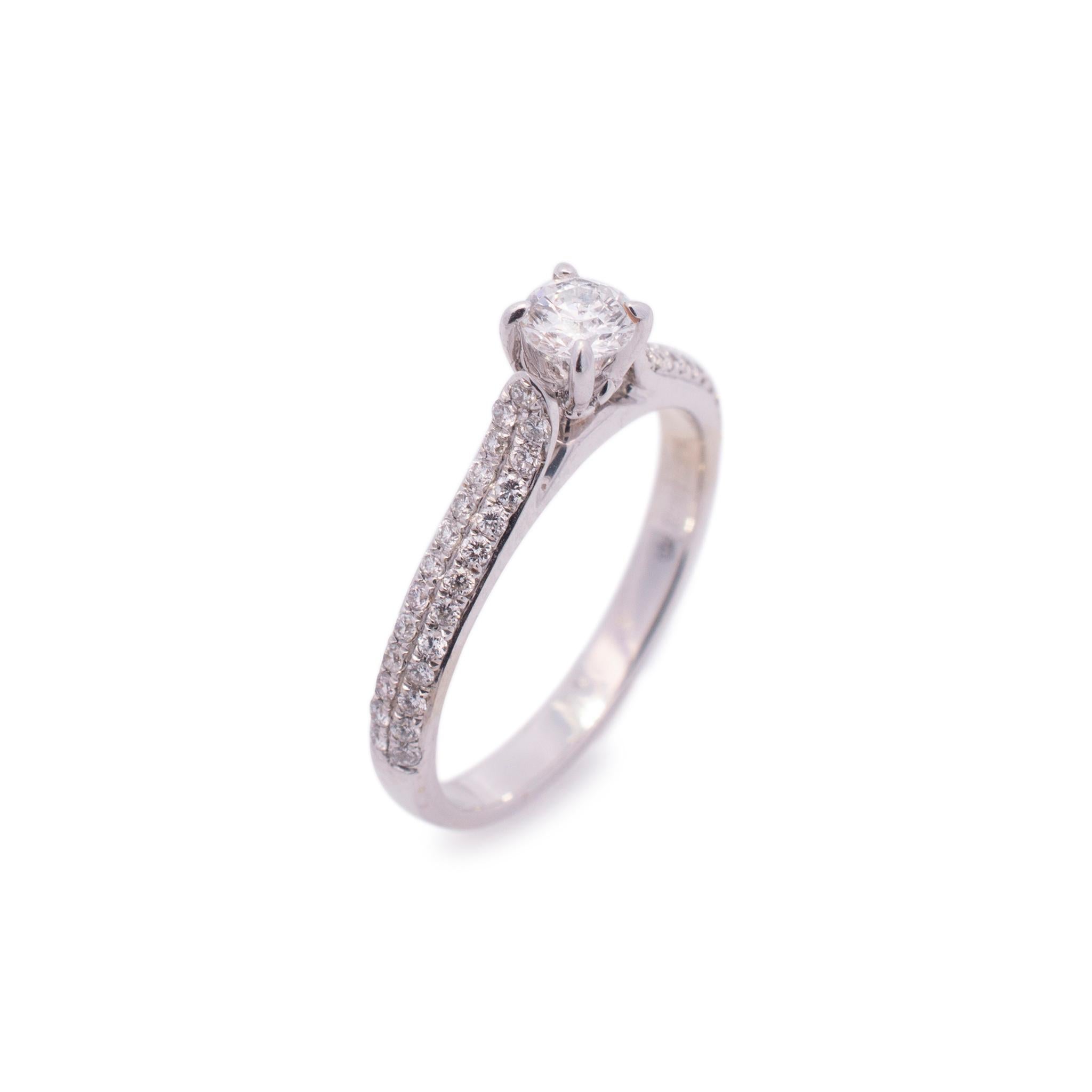 Gender: Ladies

Metal Type: 14K White Gold

Size (US): 6

Weight: 2.70 grams

Ladies 14K white gold diamond engagement ring with a half round shank.

Engraved with 
