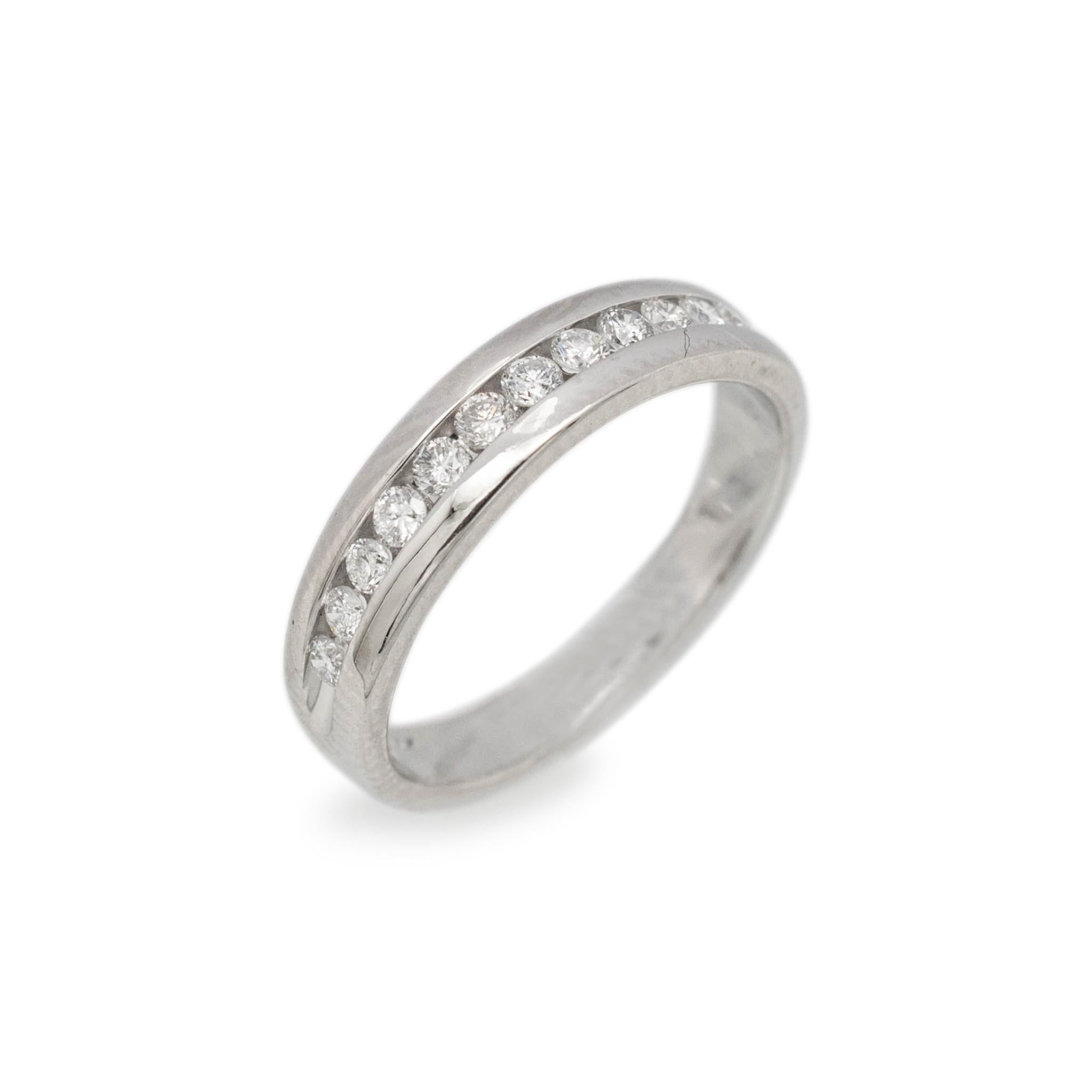 Gender: Ladies

Material: 14K White Gold

Size: 4.5

Shank Width: 4.15mm

Weight: 2.70 grams

Ladies 14K white gold diamond wedding band with a half-round shank. Engraved with 
