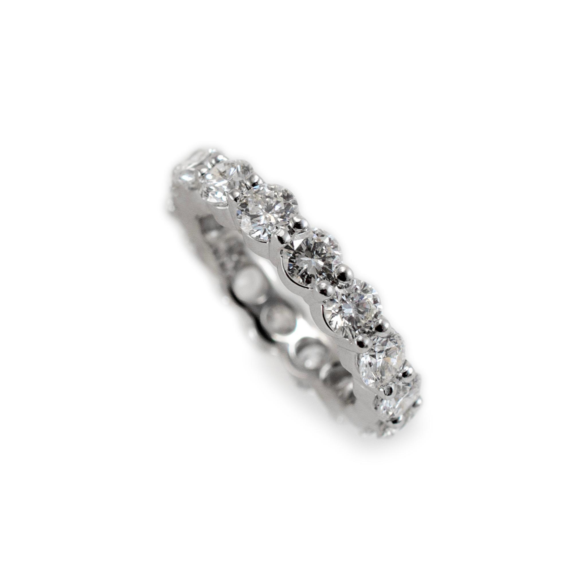 Gender: Ladies

Metal Type: 14K White Gold

Ring Size: 4

Width: 3.50 mm

Weight: 3.80 grams

Lady's rhodium-plated 14K white gold, diamond eternity ring. Engraved with 