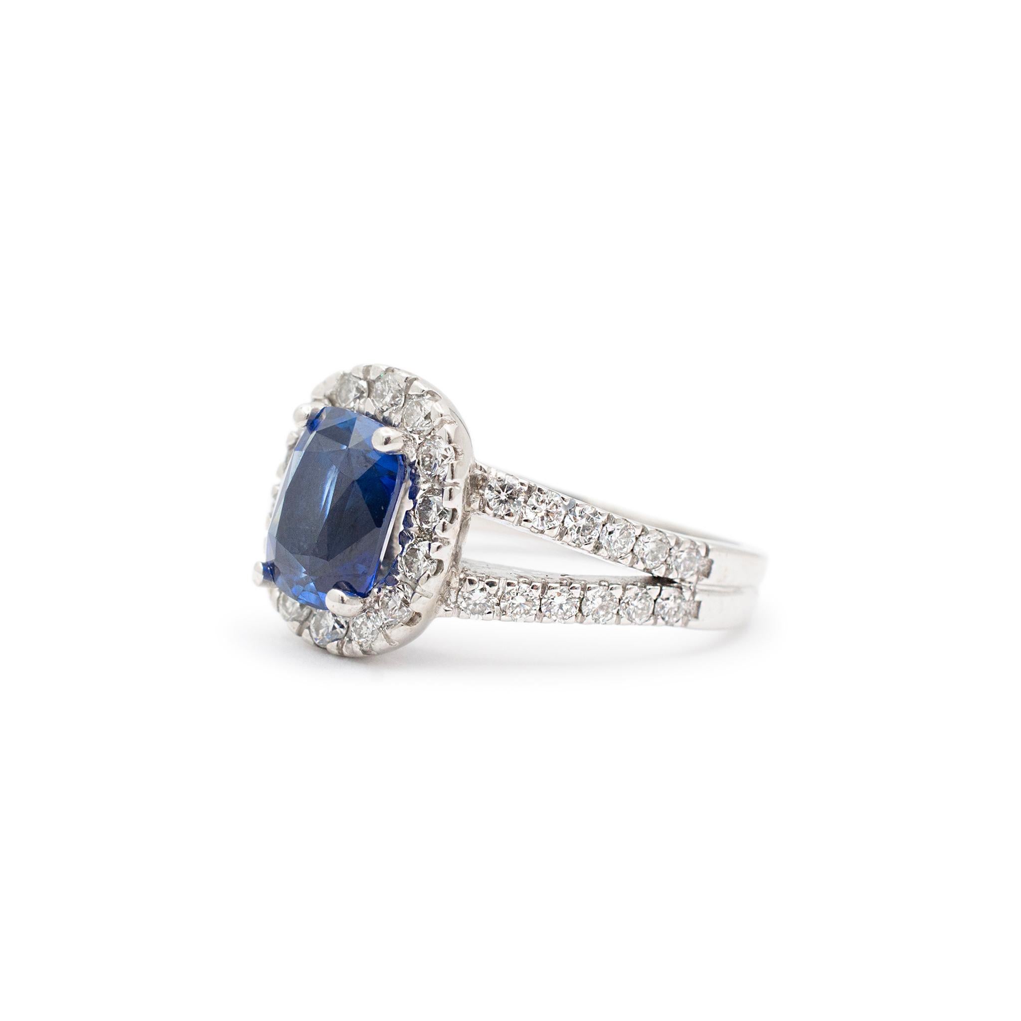 Gender: Ladies

Metal Type: 14K White Gold

Size: 5

Shank Maximum Width: 6.45mm tapering to 2.40mm

Head Measurement: 11.85mm x 9.90mm

Weight: 4.70 grams

Ladies 14K white gold diamond and sapphire accented halo cocktail ring with a split-shank