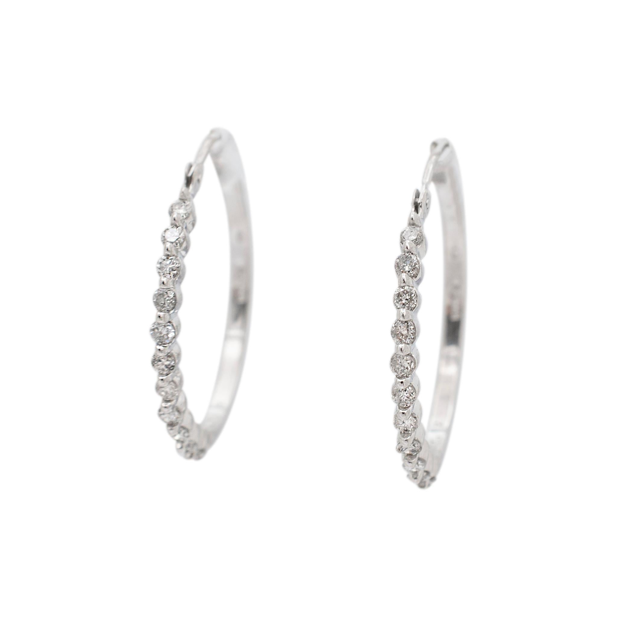 Gender: Ladies

Metal Type: 14K White Gold

Diameter: 24.00 mm

Weight: 3.40 grams
Ladies 14K white gold diamond hoop earrings. The metal was tested and determined to be 14K white gold. Engraved with 