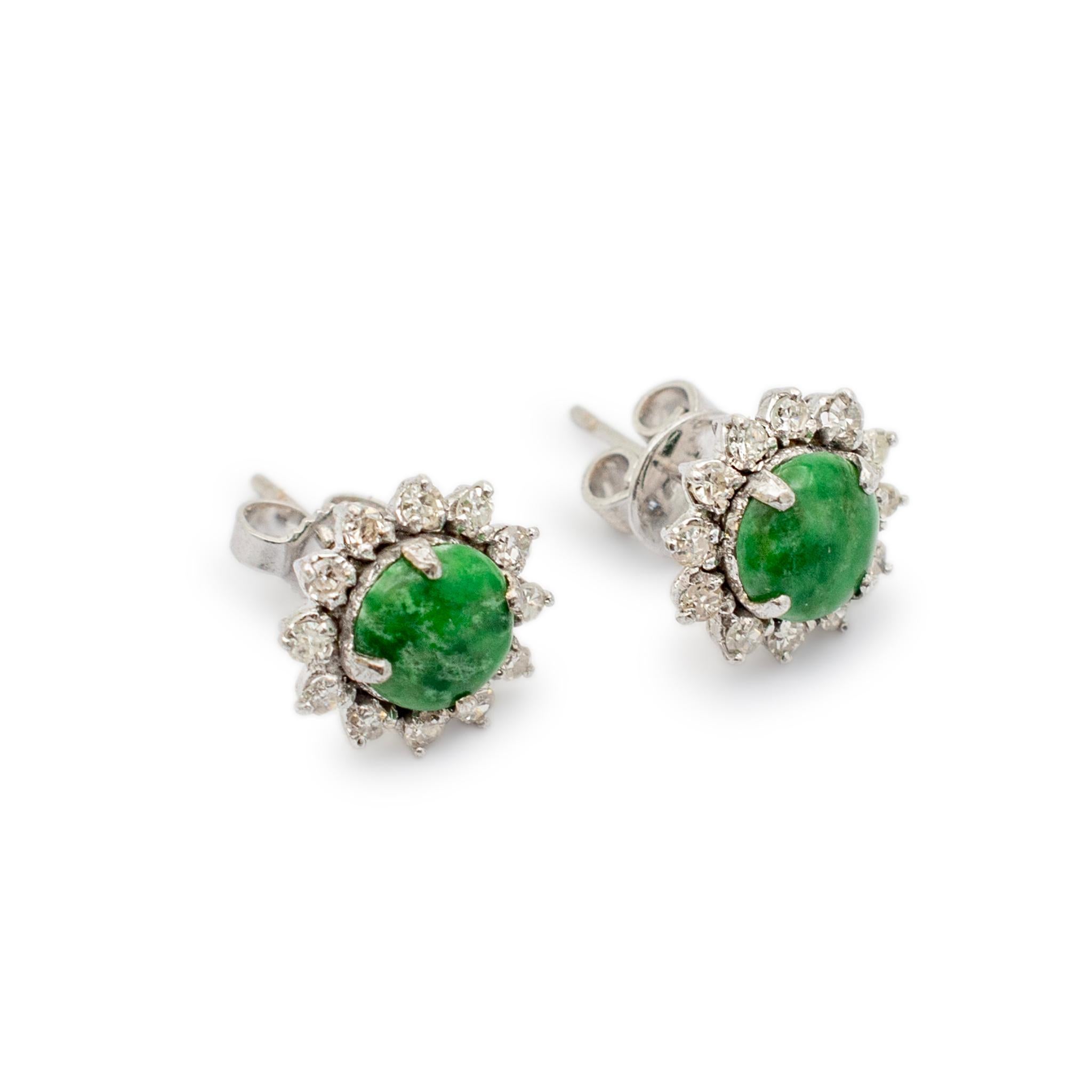 Gender: Ladies

Metal Type: 14K White Gold

Length: 0.25 inches

Diameter: 10.70 mm

Weight: 2.27 grams

One pair of ladies 14K white gold, diamond and jadeite vintage stud earrings with push backs. Engraved with 
