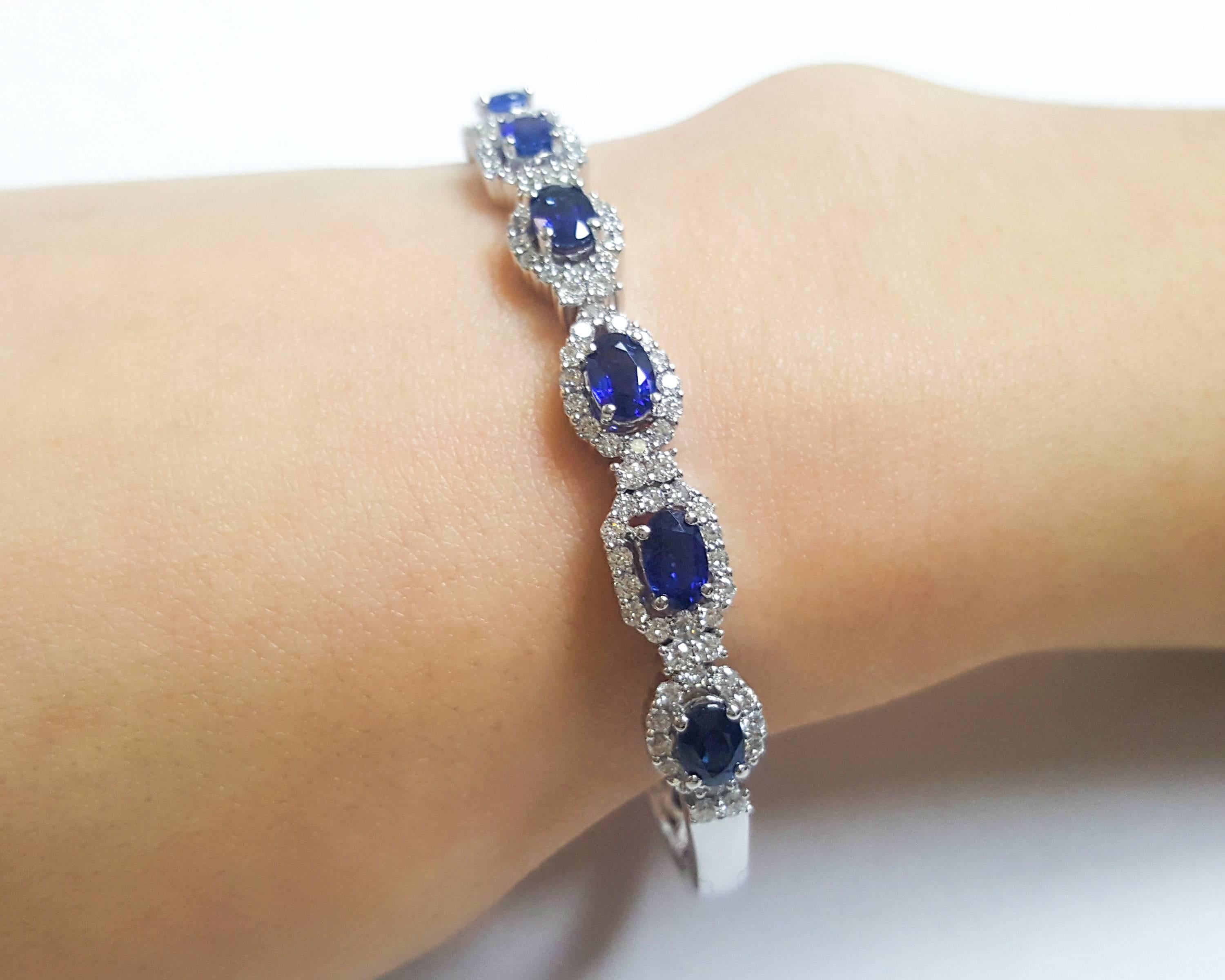 Oval Cut Ladies 14 Karat White Gold Oval Sapphire and Diamonds Bangle For Sale