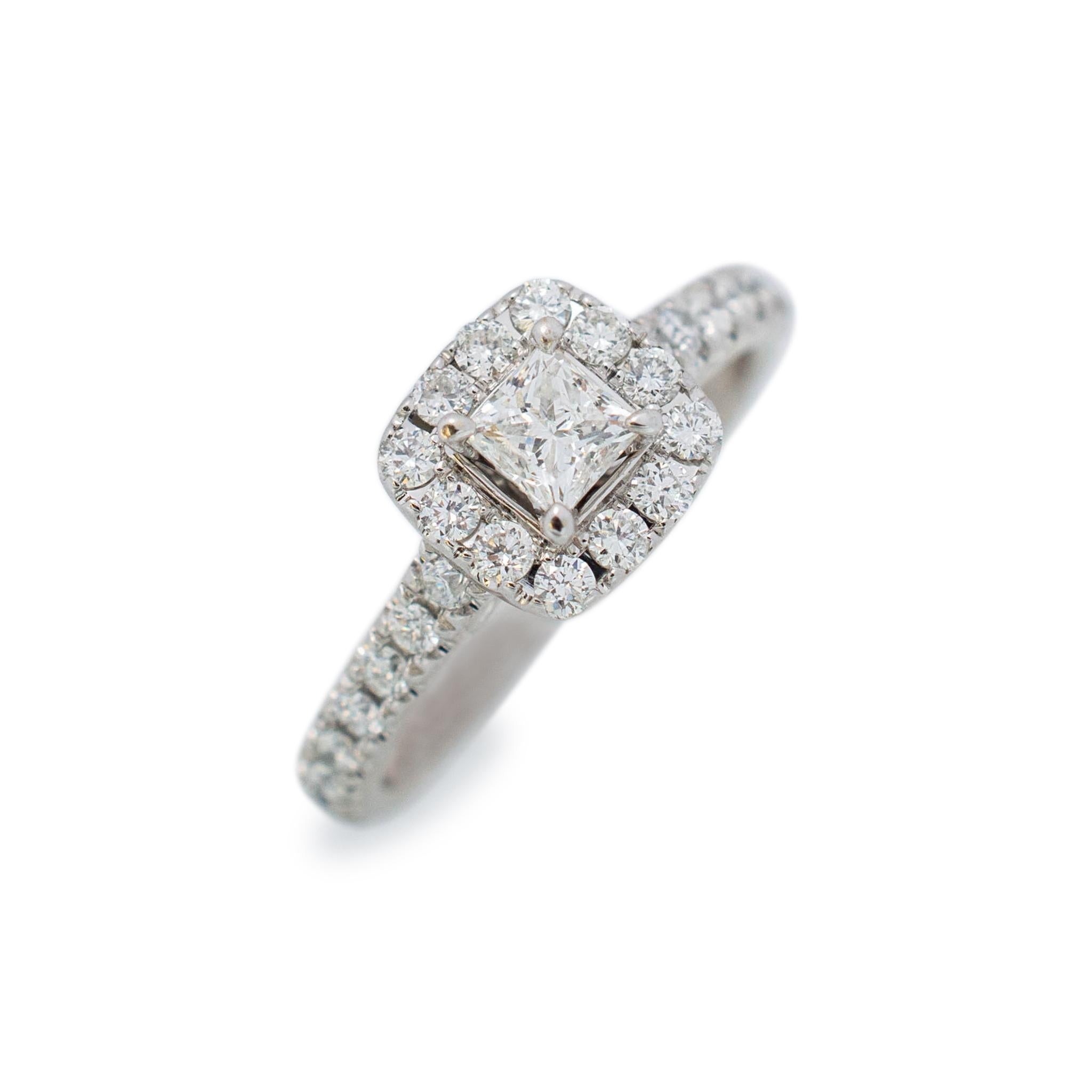 Gender: Ladies

Material: 14K White Gold

Size: 5

head measurements: 7.80mm x 8.20mm

Shank Width: 2.40mm

Ladies 14K white gold diamond engagement halo ring with a half round shank.
Pre-owned in excellent condition. Might show minor signs of