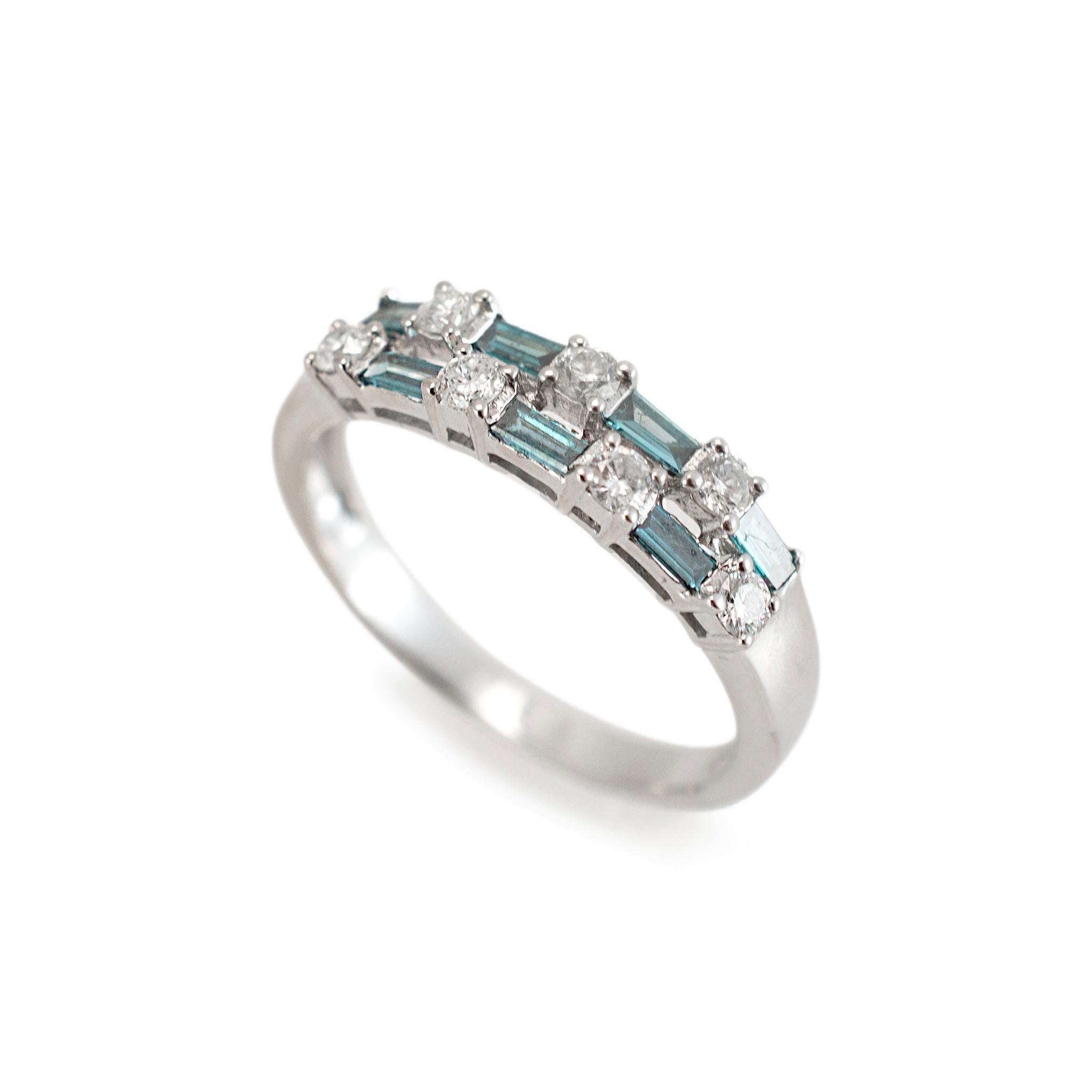 Gender: Ladies

Metal Type: 14K White Gold

Ring Size: 8

Width: 4.75 mm tapering to 2.35 mm

Weight: 2.82 grams

One ladies 14K white gold diamond semi-eternity band with a half-round shank. The metal was tested and determined to be 14K white gold.