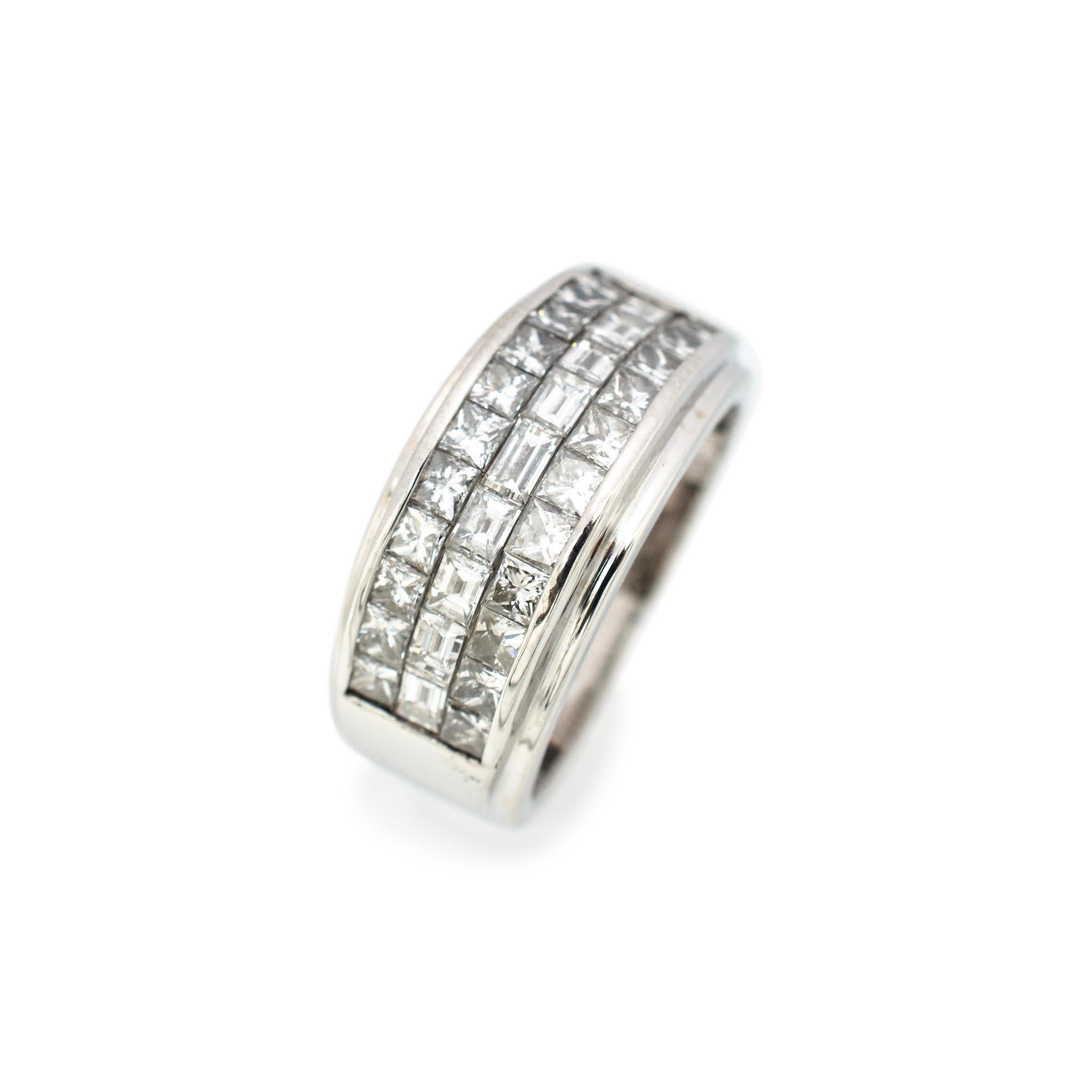 Gender: Ladies

Metal Type: 14K White Gold

Size: 7

Shank Maximum Width: 9.80 mm

Weight: 9.40 grams

Ladies 14K white gold three-row diamond wedding band with a tapered comfort-fit shank. Engraved with 