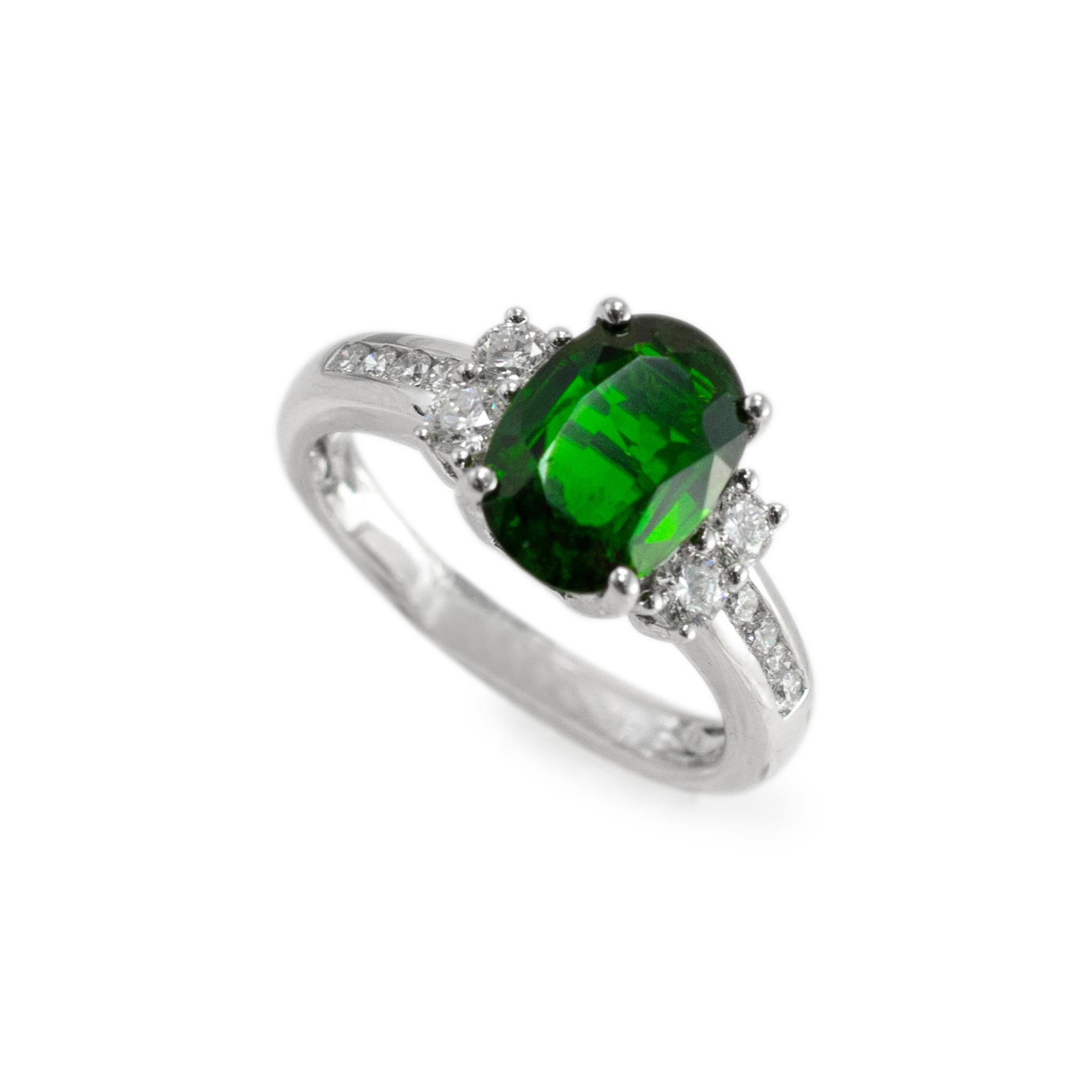 Gender: Ladies

Metal Type: 14K White Gold

Ring size: 7.25

Weight: 4.71 grams

One ladies Rhodium plated 14K white gold diamond and tourmaline cocktail ring with a half-round shank, Engraved with 