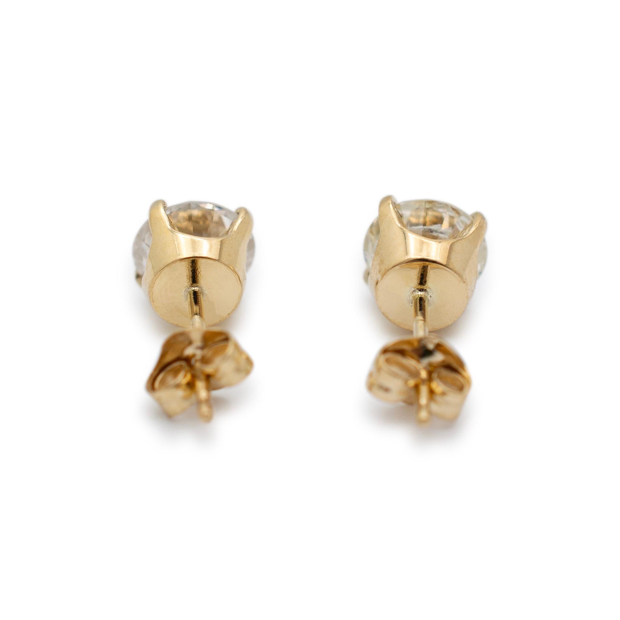 Gender: Ladies

Metal Type: 14K Yellow Gold

Length: 0.50 Inches

Diameter: 6.25 mm

Weight: 1.34 grams

Ladies 14K yellow gold diamond stud earrings with push backs. The metal was tested and determined to be 14K yellow gold. Engraved with