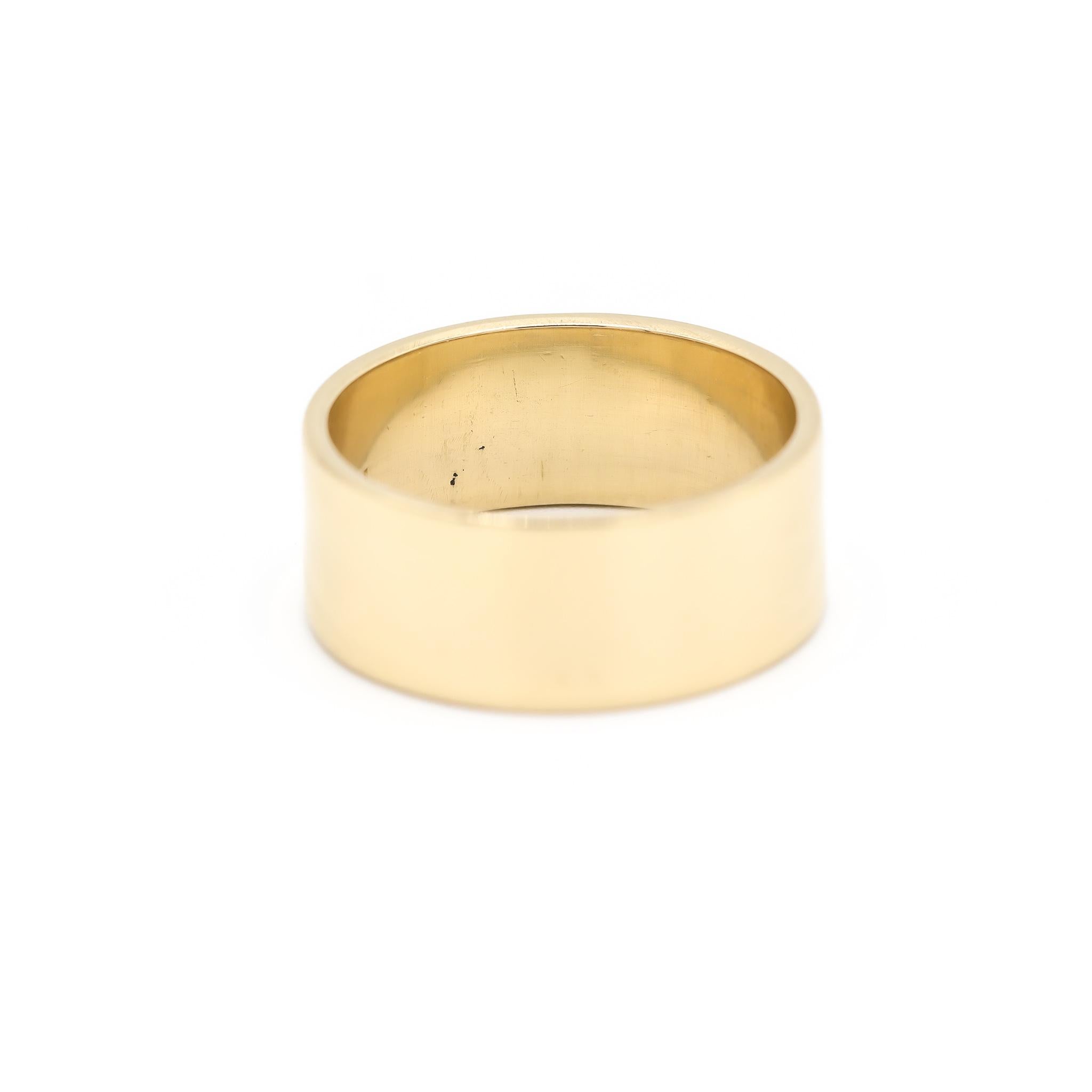 One lady's custom made polished 14K yellow gold, solitaire band with a soft-square shank. The band is a size 6. The band weighs a total of 5.40 grams. Stamped 