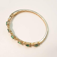 Ladies 14 Karat Yellow Gold Emerald and Diamond Bangle