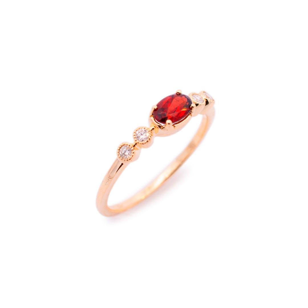 Gender: Ladies

Metal Type: 14K Yellow Gold

Size (US): 4.75

Shank Width: 1.10mm

Head Measurements: 3.90mm in width

Weight: 1.36 grams

Ladies 14K yellow gold diamond and garnet band with a half-round shank.
Stamped 