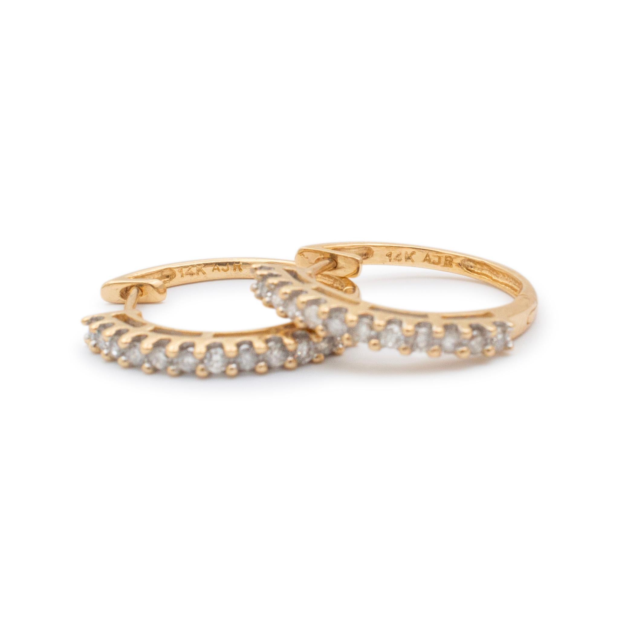 Gender: Ladies

Metal Type: 14K Yellow Gold

Length: 0.75 Inches

Width: 20.90 mm

Weight: 3.63 grams

Ladies 14K yellow gold diamond hoop earrings with locking backs. Engraved with 