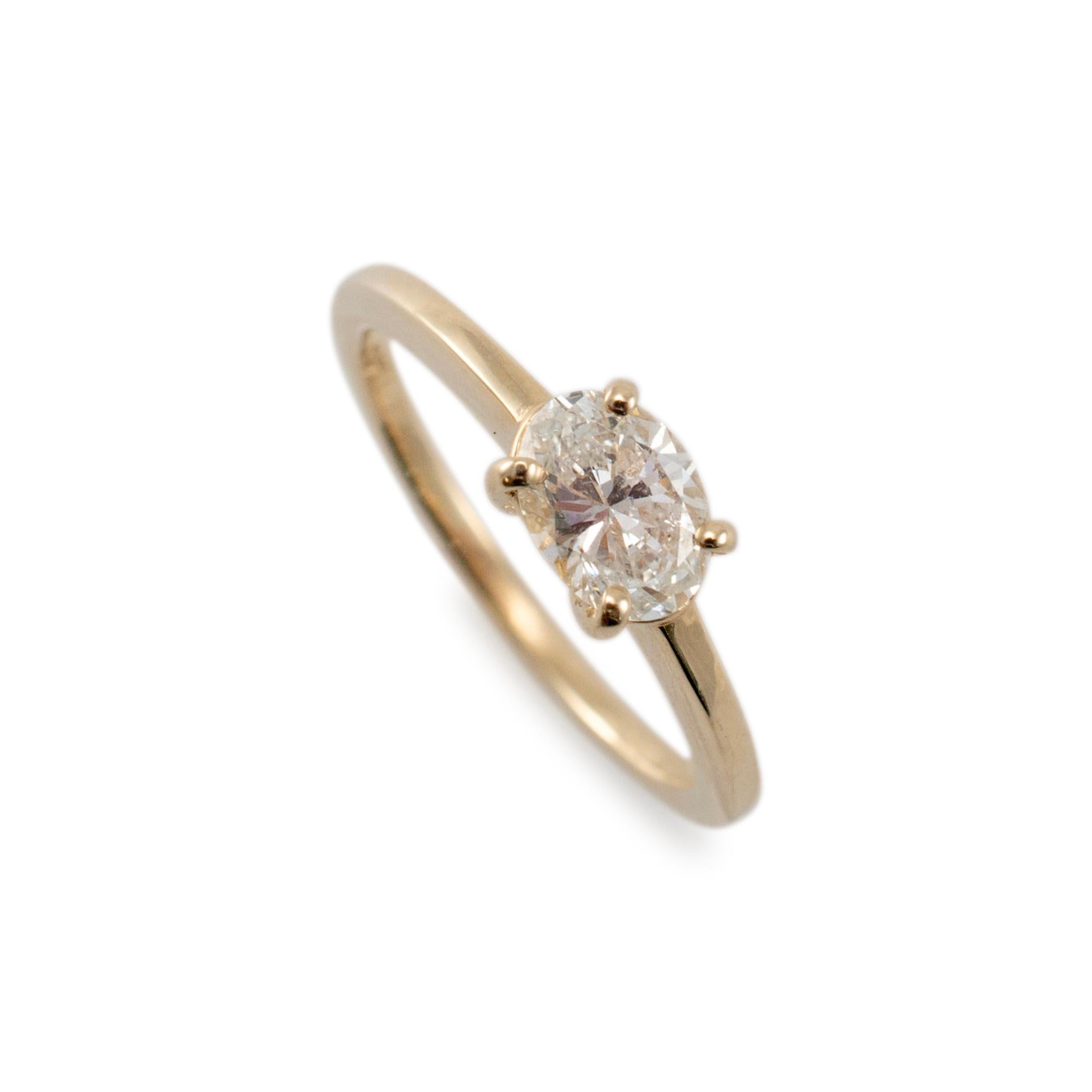 Gender: Ladies

Metal Type: 14K Yellow Gold

Ring Size: 4.25

Shank Maximum Width: 1.40 mm

Weight: 1.88 grams

Ladies 14K Yellow Gold diamond solitaire engagement ring with a half-round shank. The metal was tested and determined to be 14K yellow