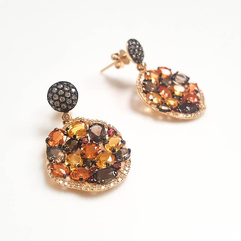 This Ladies 14k Yellow Gold Ladies 14k Yellow Gold Multi Colors Stone and Diamond Earrings has 2.81 carats of Smokey Quartz, 0.32 carats of CHAM Diamond, 6.22 carats of Orange Sapphire and 0.23 carats of Diamonds. Comfort Fit Earring for Everyday