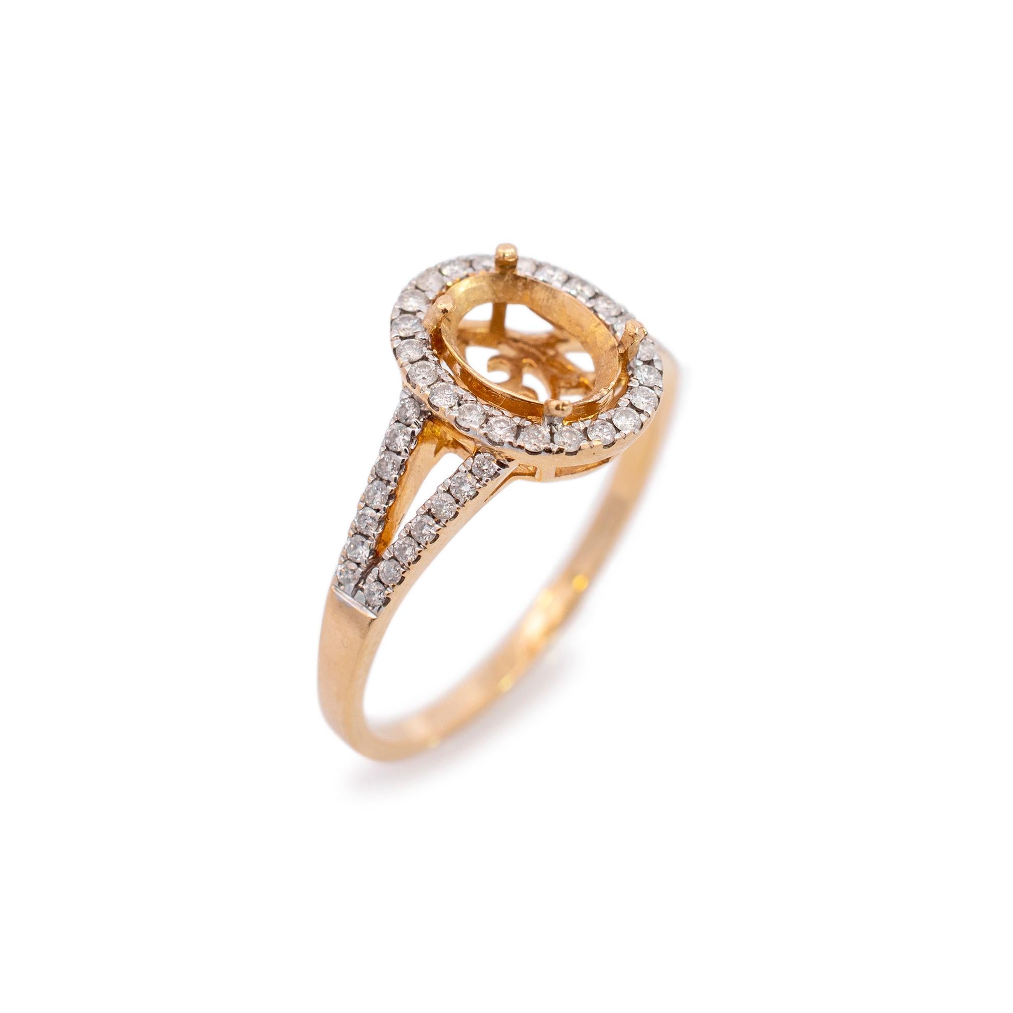 One lady's custom made polished 14K yellow gold, diamond halo, engagement, semi-mount ring with a half round shank. The ring is a size 8. The ring weighs a total of 2.90 grams. Engraved with 