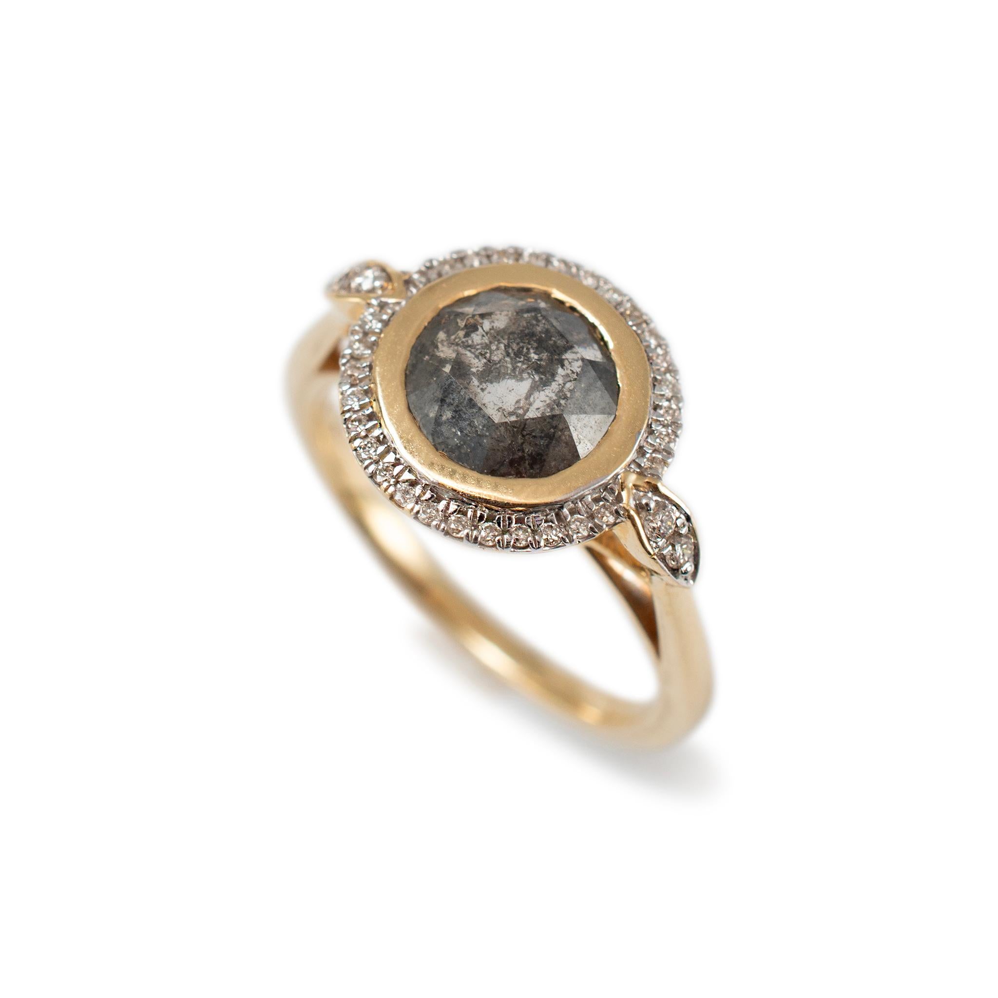 Gender: Ladies

Metal Type: 14K Yellow Gold

Ring Size: 7

Weight: 4.12 grams

One ladies 14K yellow gold diamond contemporary-style halo cocktail ring with a half-round shank. The metal was tested and determined to be 14K yellow gold. Engraved with