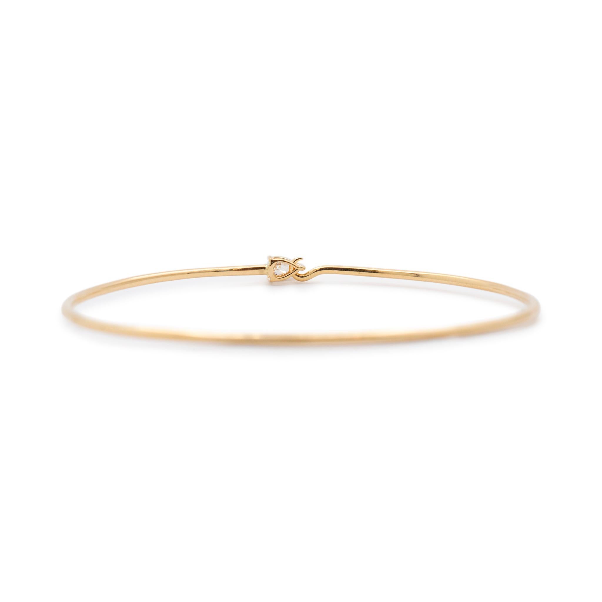 Gender: Ladies

Metal Type: 14K Yellow Gold

Length: 5.50 inches

Width: 1.45 mm

Weight: 3.82 grams

Ladies 14K yellow gold diamond bangle bracelet. The metal was tested and determined to be 14K yellow gold. Engraved with 