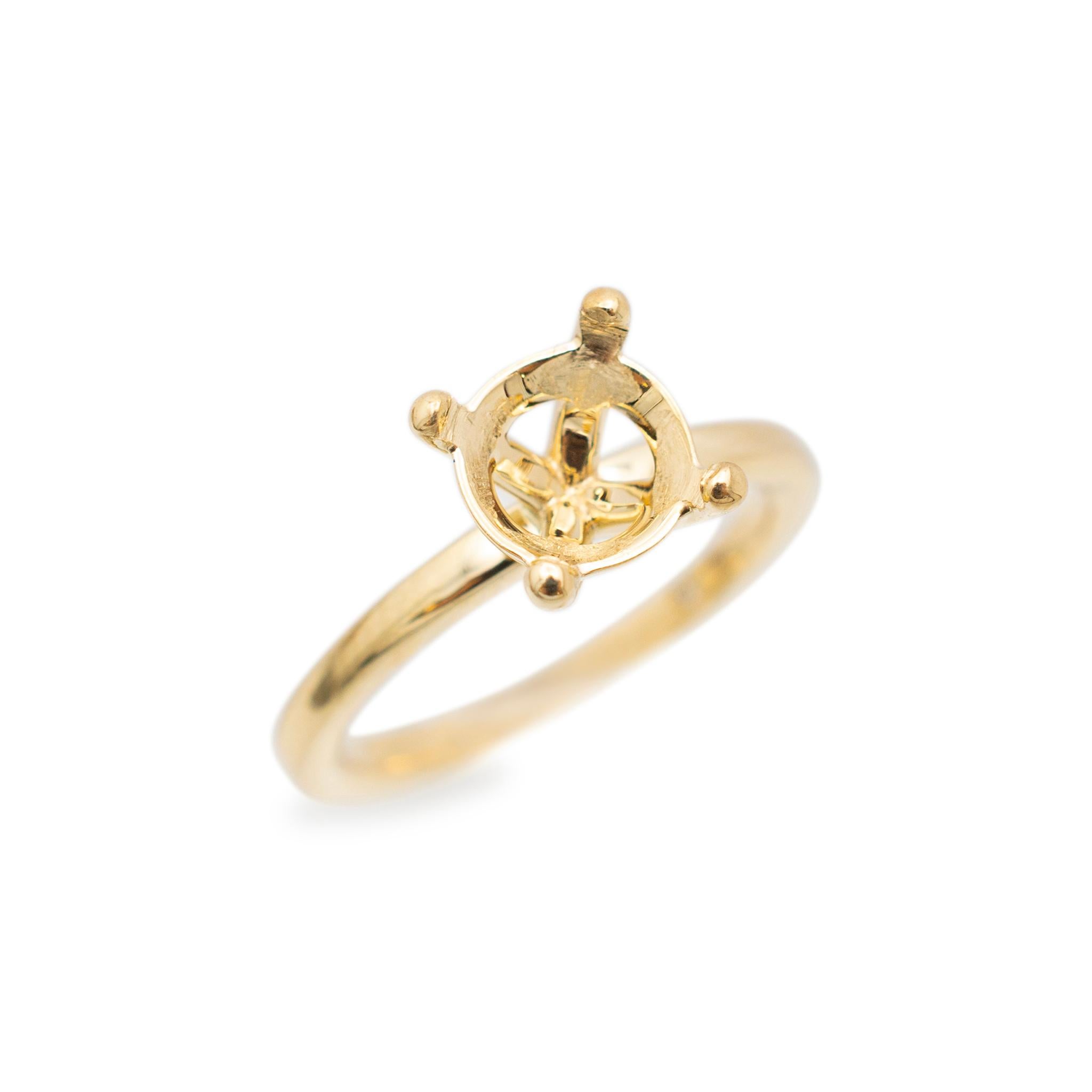 Gender: Ladies

Metal Type: 14K Yellow Gold

Size: 4

Shank Maximum Width: 1.90 mm

Weight: 2.64 grams

Ladies 14K yellow gold solitaire engagement semi-mount ring with a half round shank. The metal was tested and determined to be 14K yellow gold.