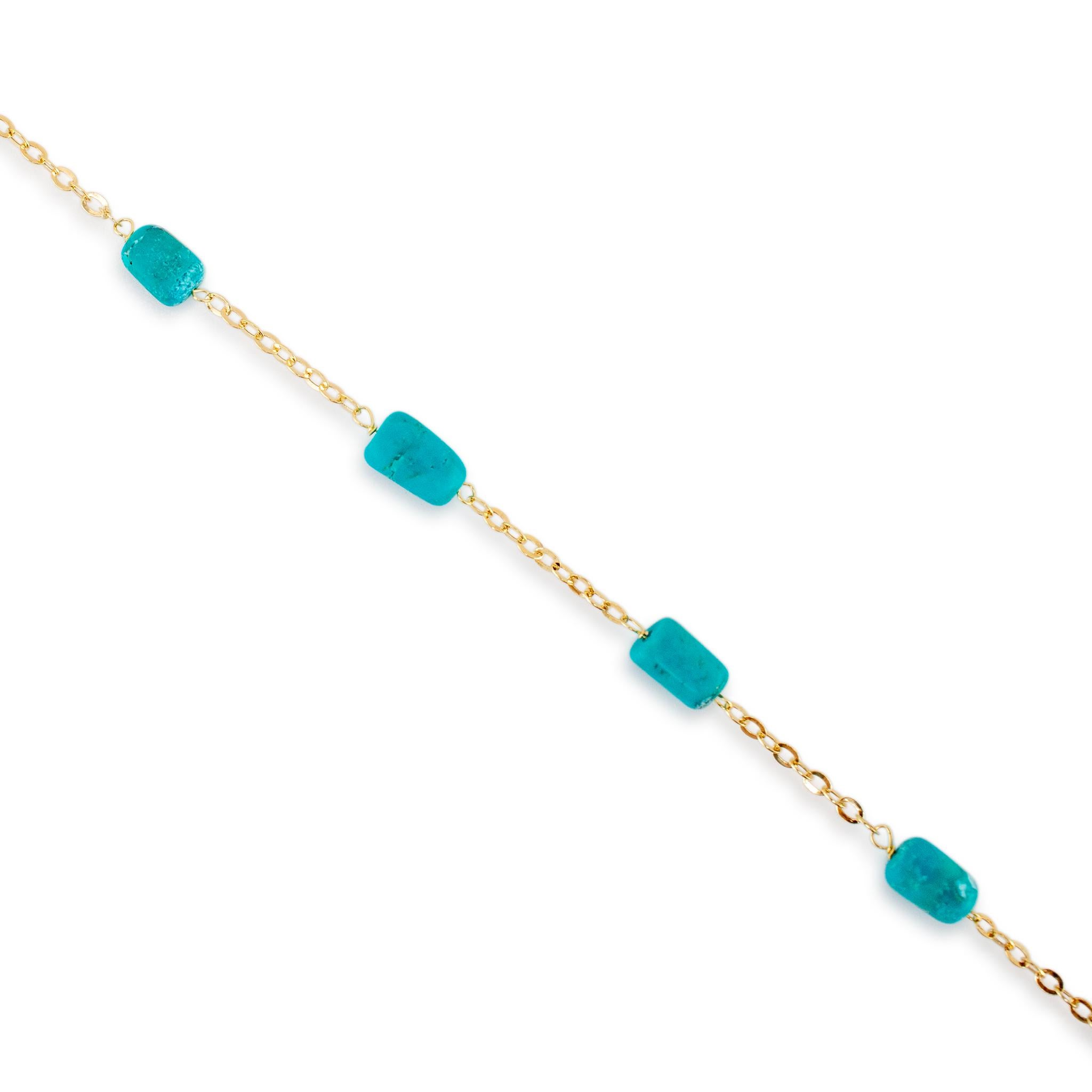 Gender: Ladies

Metal Type: 14K Yellow Gold

Length: 16.00 inches

Chain Width: 1.55 mm

Weight: 2.34 grams

One ladies 14K yellow gold single strand turquoise station necklace. The metal was tested and determined to be 14K yellow gold. Engraved