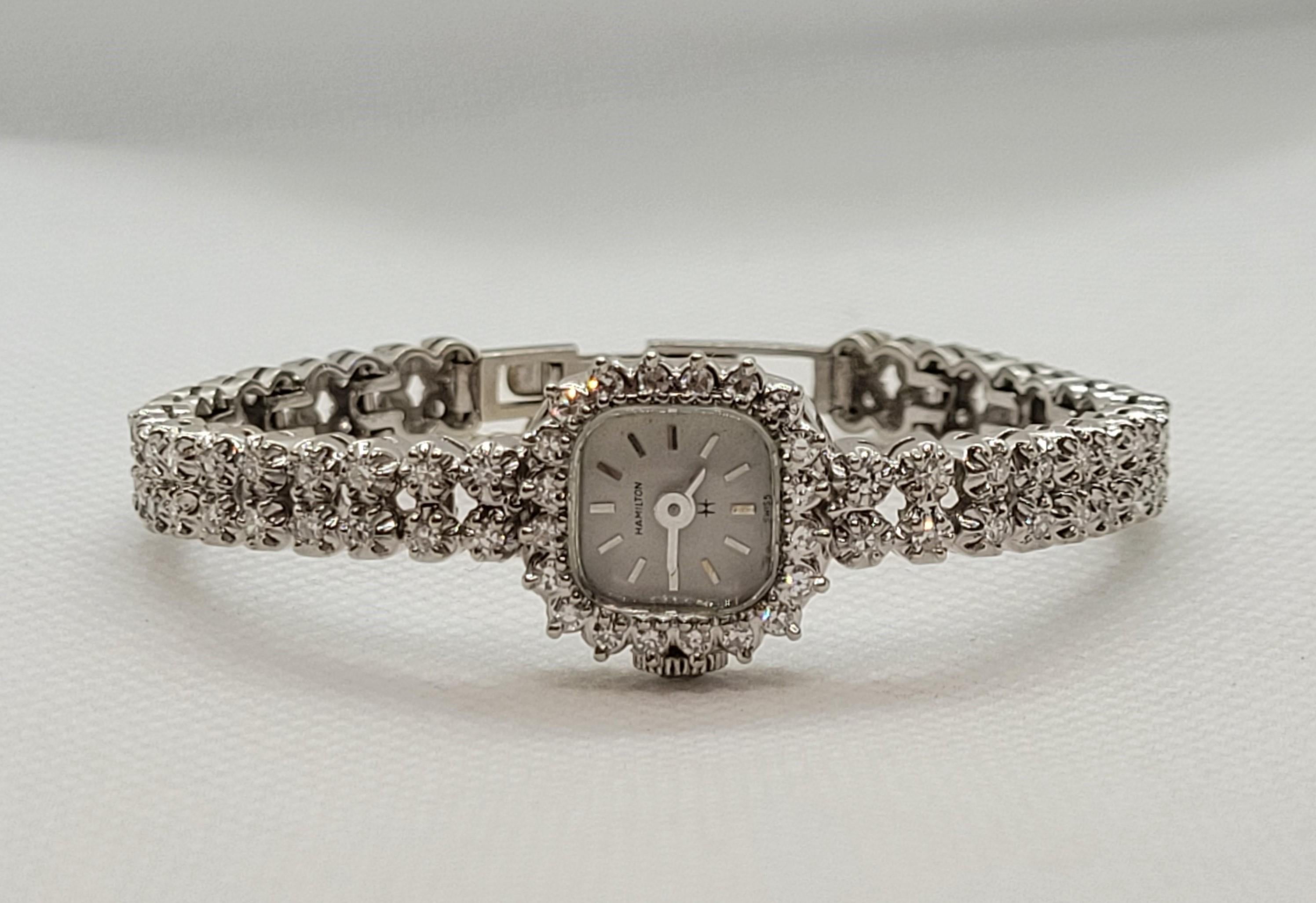 Ladies 14kt white gold diamond Hamilton watch with 56 diamonds of approximately 1.00cttw that are G in color and VS/SI in clarity. The watch has been serviced by our watchmaker, has a quartz movement, and comes with a 90-day warranty. The rounded