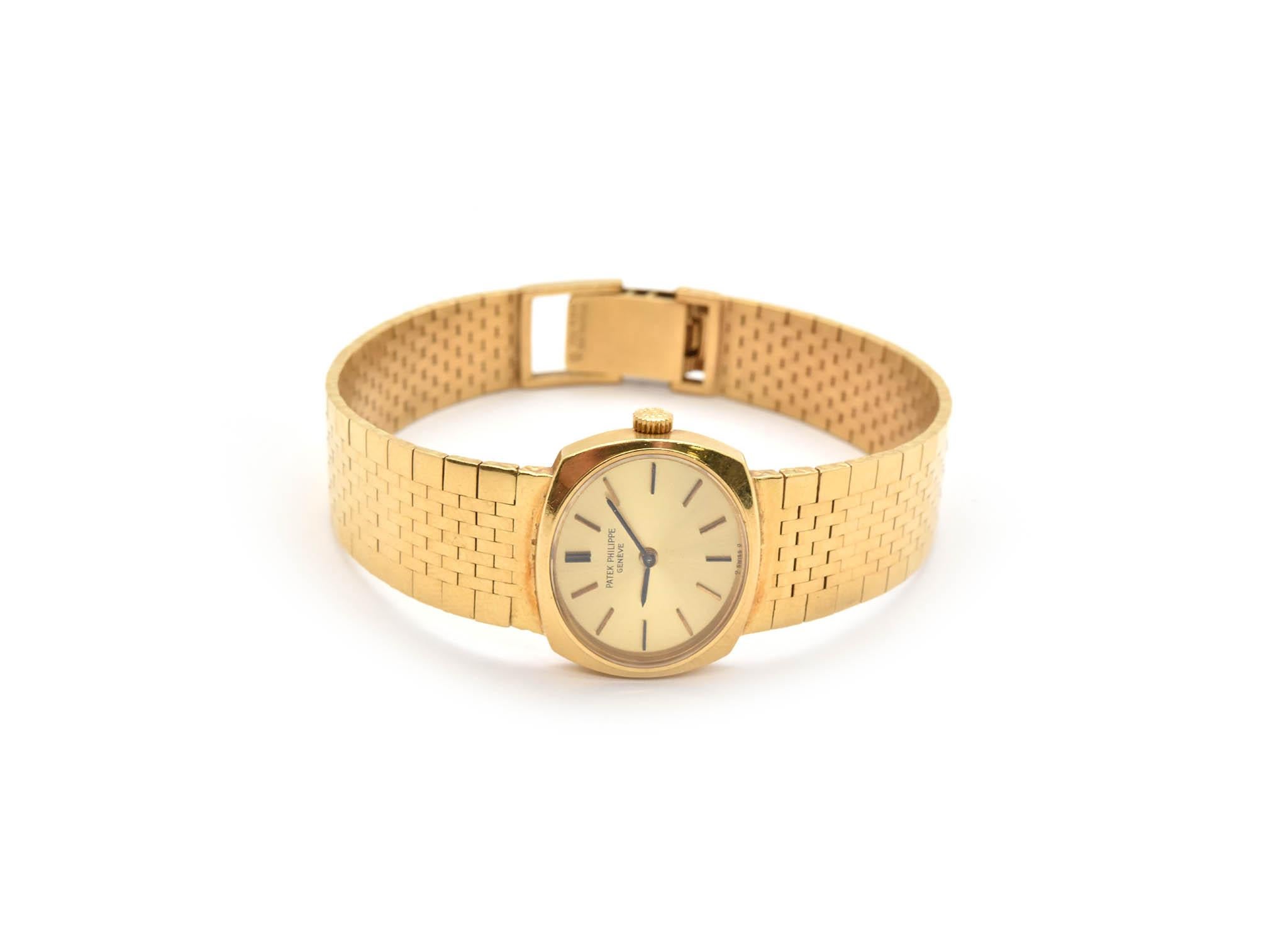 Movement: 20 jewel manual wind movement
Function: hours, minutes
Case: 23mm 18k yellow gold case, sapphire crystal
Band: 18k yellow gold bracelet, fits up to a 7-inch wrist
Dial: champagne dial, black hands, gold hour markers
Reference #: